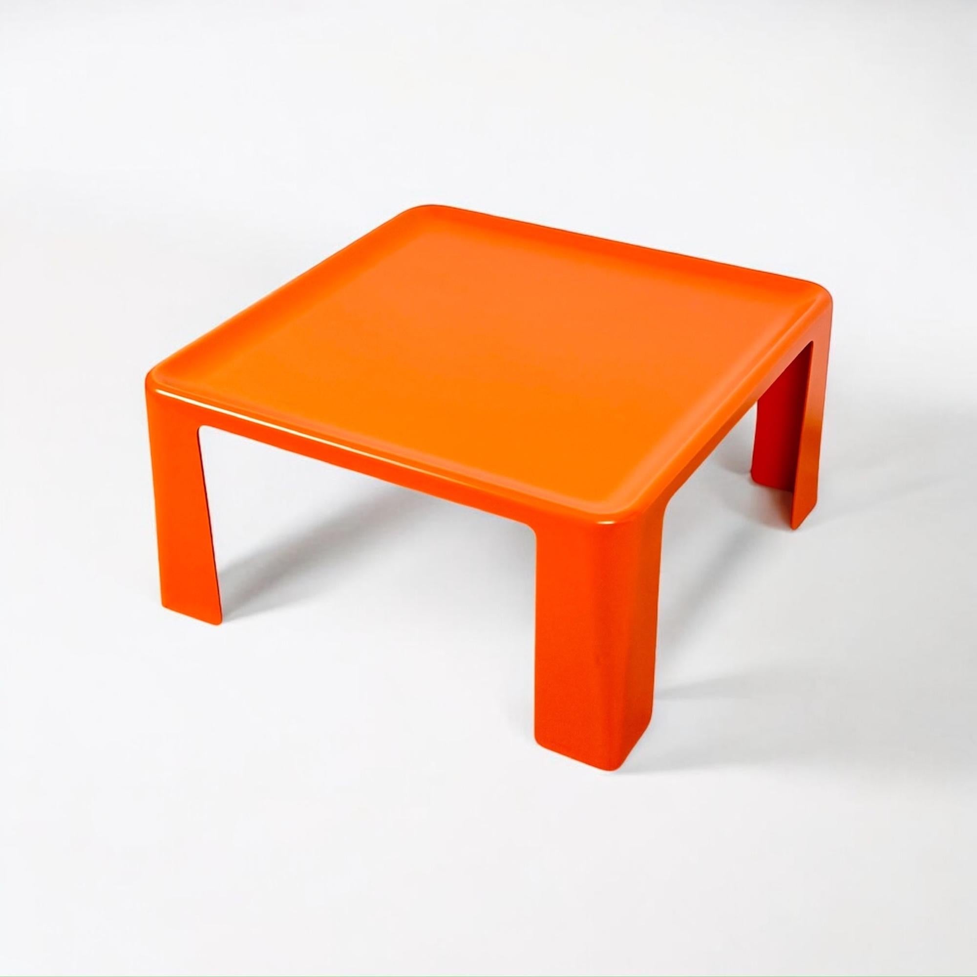 The Amanta Table, designed by Mario Bellini for C&B Italia in the 1960s, is a masterpiece of mid-century modern design. Crafted from durable fiberglass (Fiberlite), this orange coffee table features a square shape with an indented tabletop—an