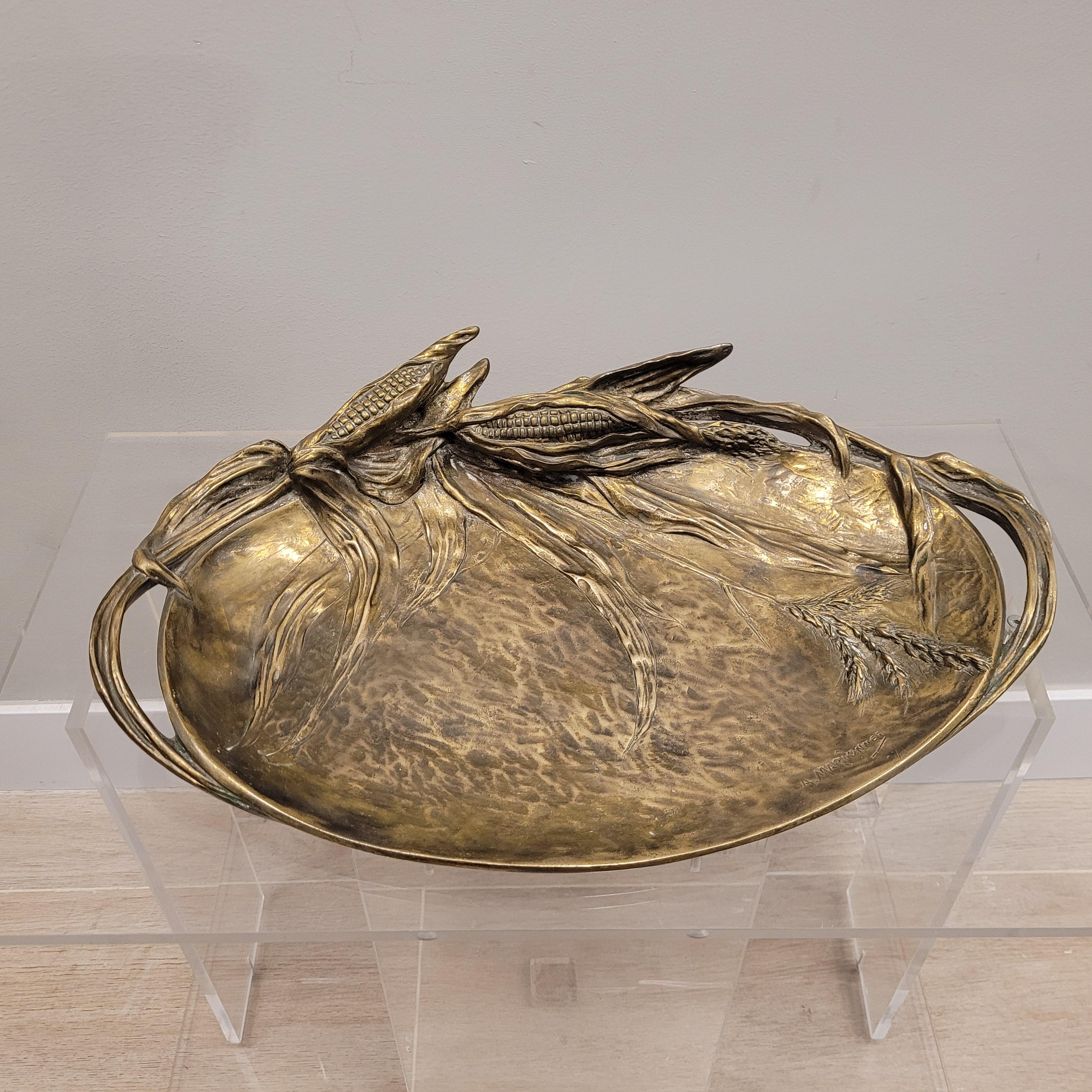 One of a kind  fruit bowl or centerpiece by Albert Marionnet .
 Oval profile in embossed bronze, with a beautiful golden patina, decorated in half relief with corn cobs, leaves and the corn flower, with a hammered bottom.

It is the creation of