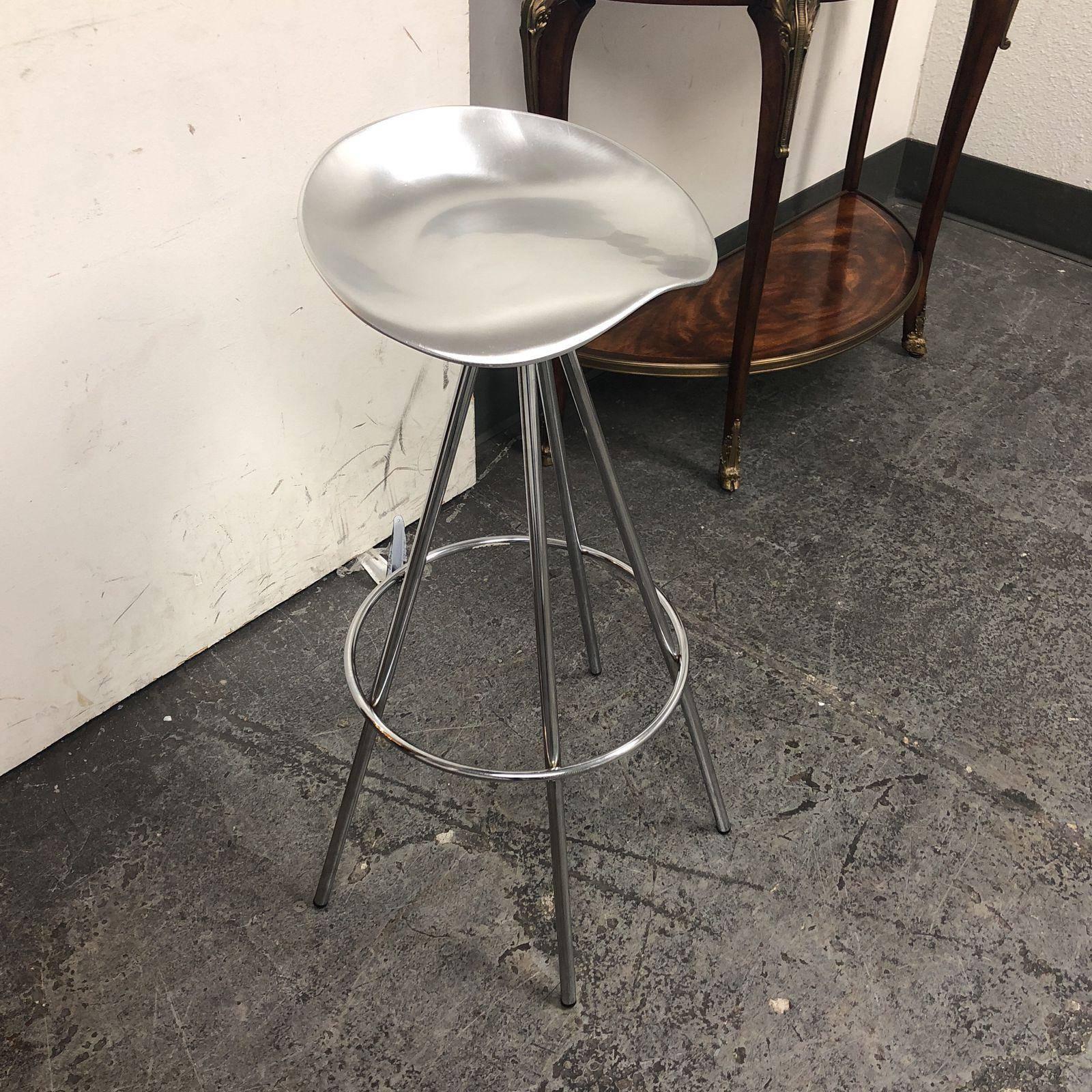 A Jamaica stool. The stool was designed by Pepe Cortes for Amat in Spain, it was distributed by Knoll. The stool has an Aluminum saddle-like seat which swivels and a chrome frame.
 