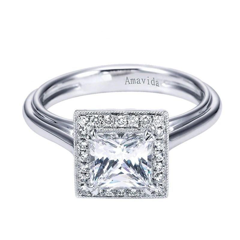 Classic and clean lines put the spotlight on the center diamond in this elegant platinum diamond mounting. Diamond halo in princess cut shape accommodates a princess cut stone up to 1.25 ct weight. Mounting halo contains 0.15 ctw of premium round