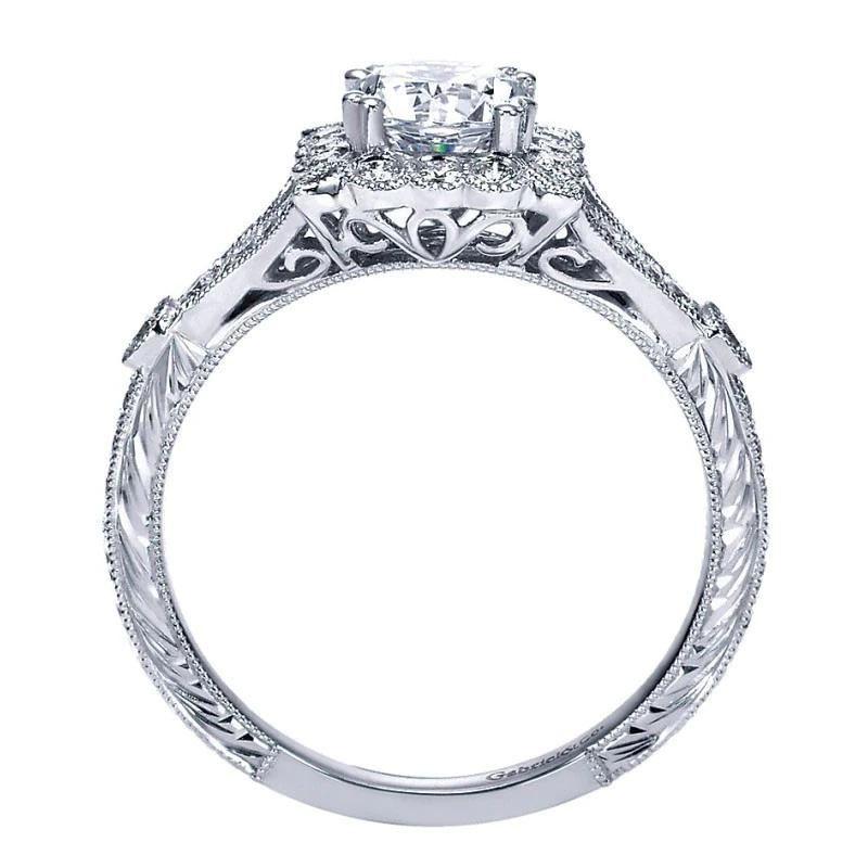 If you are looking for a one of a kind platinum diamond engagement ring, look no further! This mounting features vintage inspired details such as diamond etching on the sides, milgrain finish around the diamonds, split shank, and of course an