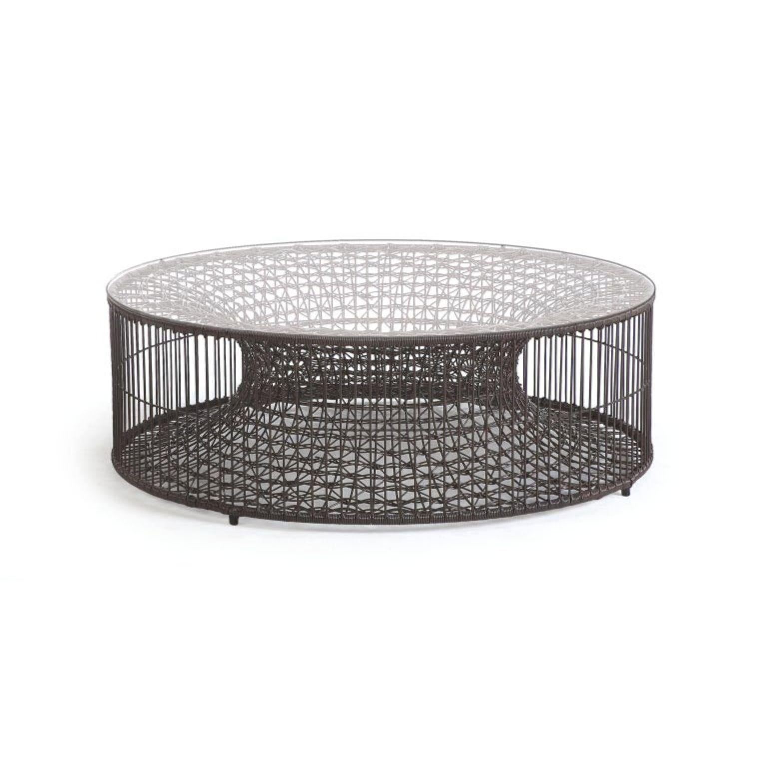 Amaya coffee table, Kenneth Cobonpue.
Materials: Abaca, steel.
Dimensions: D 102 x W 102 x H 34 cm.

Also available for outdoor.

Kenneth Cobonpue is a multi-awarded furniture designer and manufacturer from Cebu, Philippines. His passage to