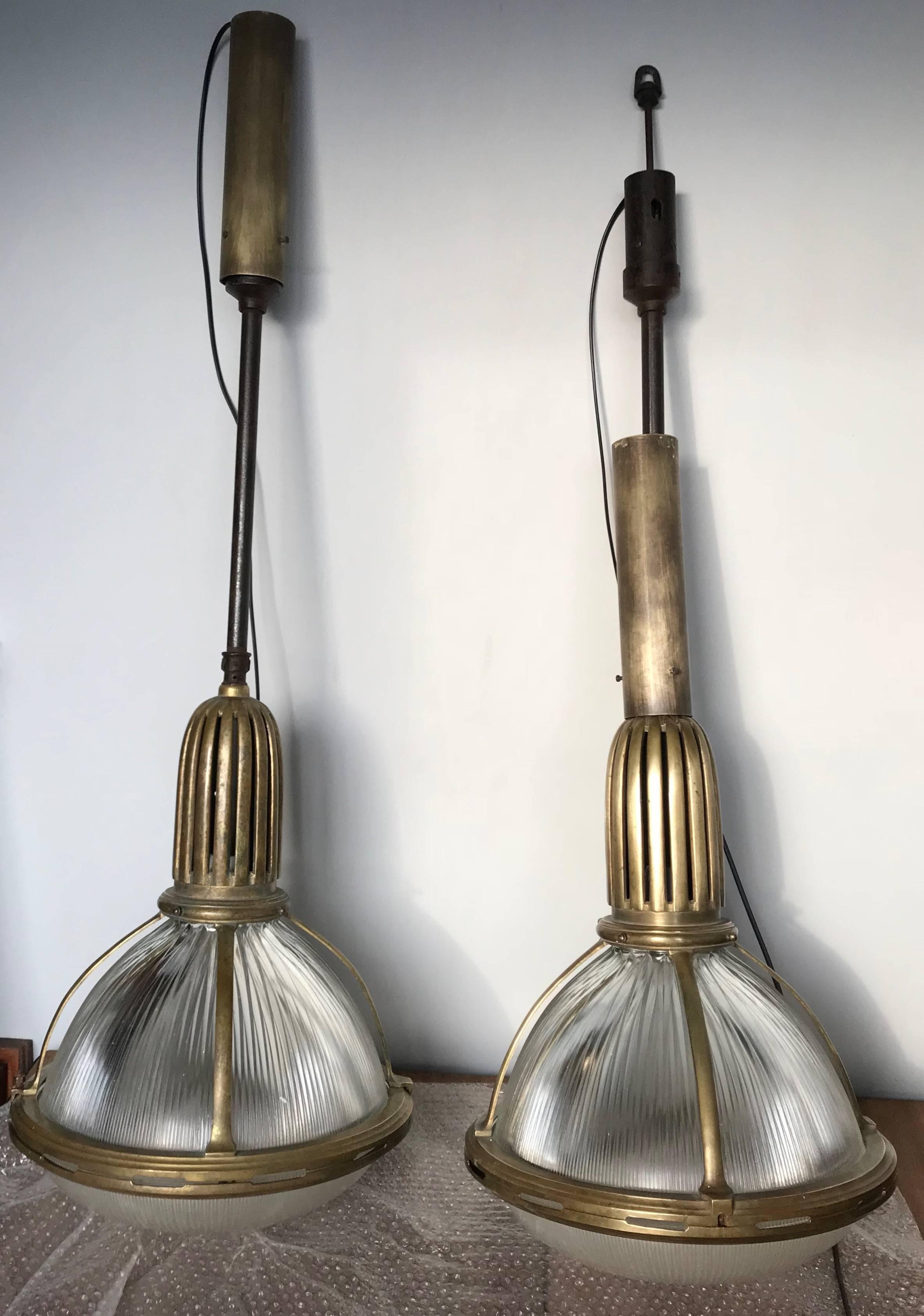 Large size and great shape, Holophane marked pendants.

Photo's 11 till 14 are with matching pendant, item number listing  LU2341310033531. 

The former owners told us that this large pair of stunning Holophane pendants was salvaged from a hotel in