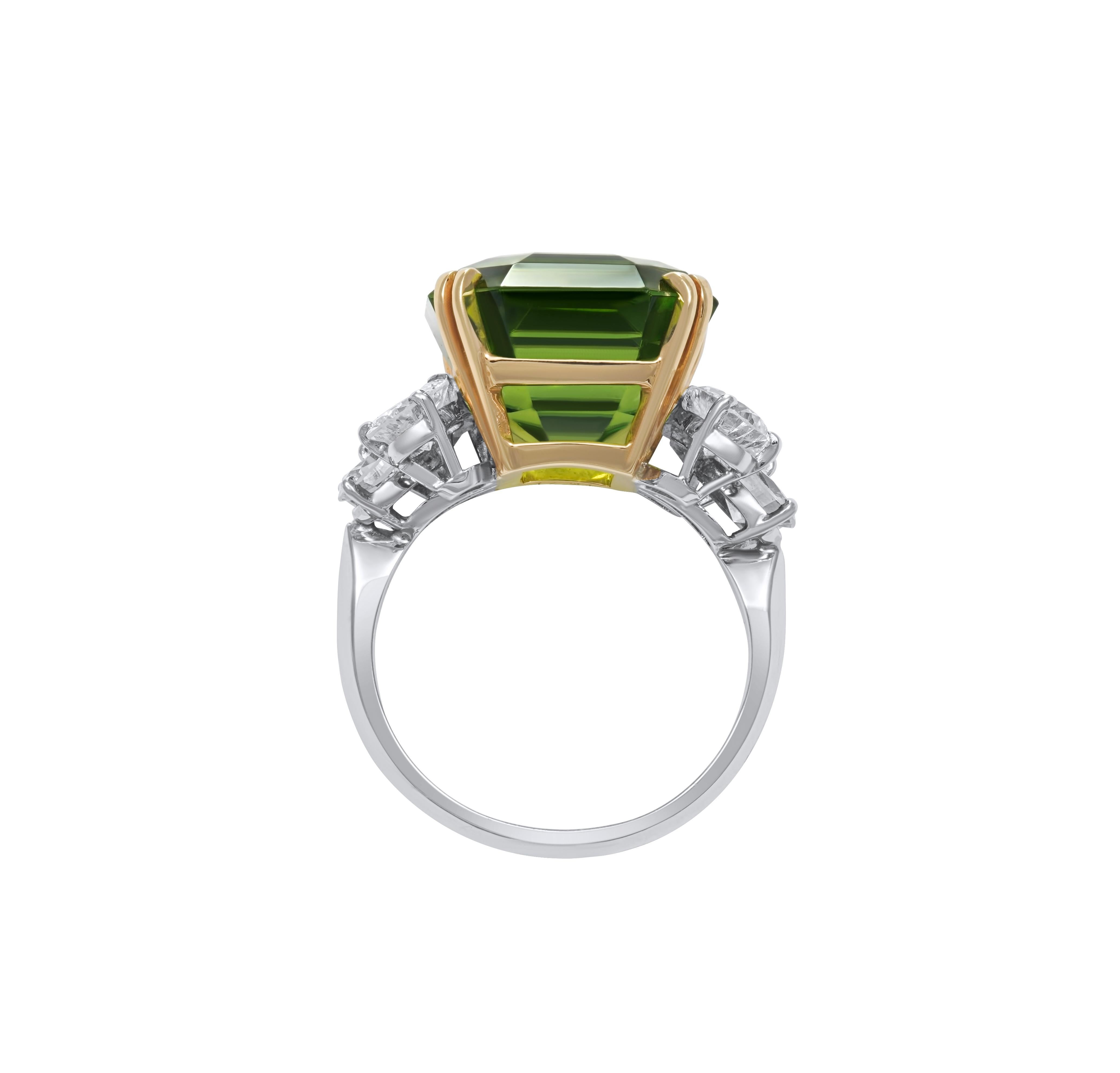 Ring in platinum and yellow gold set with a beautiful 14,81 carats peridot and 2,26 carats of diamonds. 
weight : 9,5 grs
Ring size : 54 (French size) the ring is resizable id needed. 