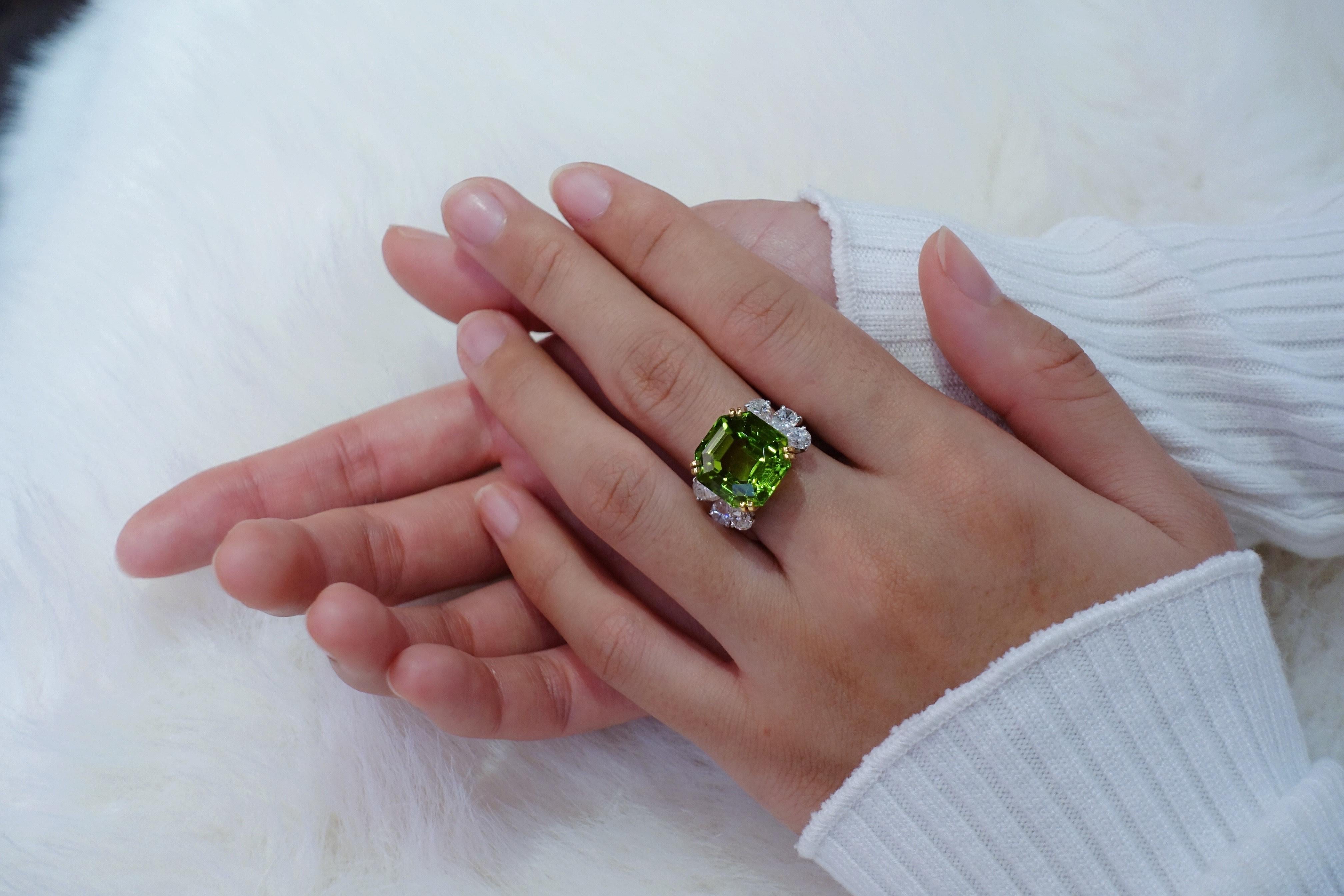 Emerald Cut Amazing 14, 81 carats peridot, diamonds platinum and gold ring. 