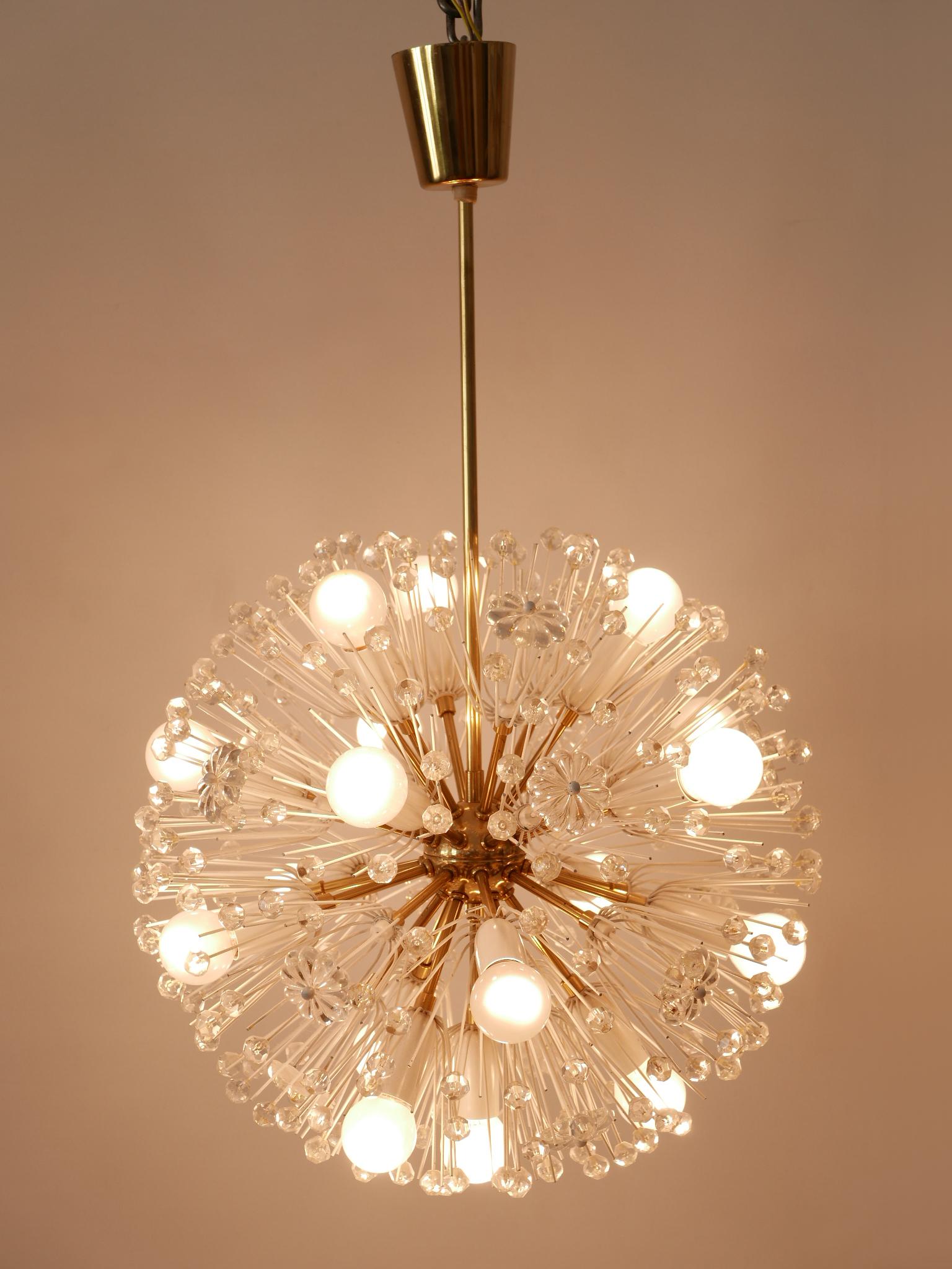 Amazing light object. Lovely and highly decorative Mid-Century Modern sputnik chandelier 'dandelion'. Designed by Emil Stejnar for Rupert Nikoll, Austria, 1950s.

Executed in brass, glass pearls and flowers, the chandelier is executed with 17 x E14