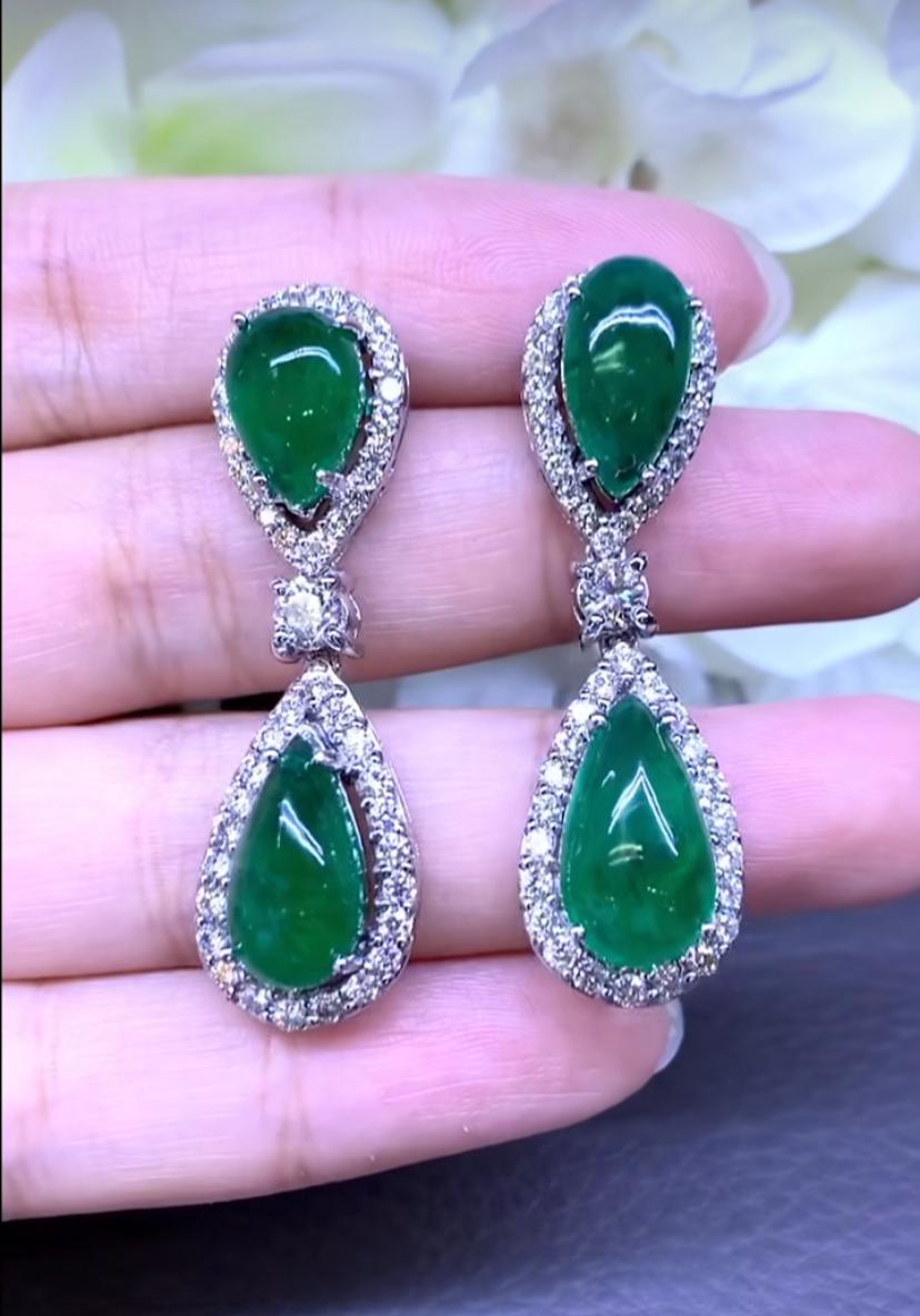 An exclusive design, so chic and refined style, perfect for every days, and events.
Earrings come in 18k gold with 4 pieces of  natural Zambia Emeralds ,pear  cabochon cut, fine quality, of 16 carats, very hard color , and 96 pieces of round