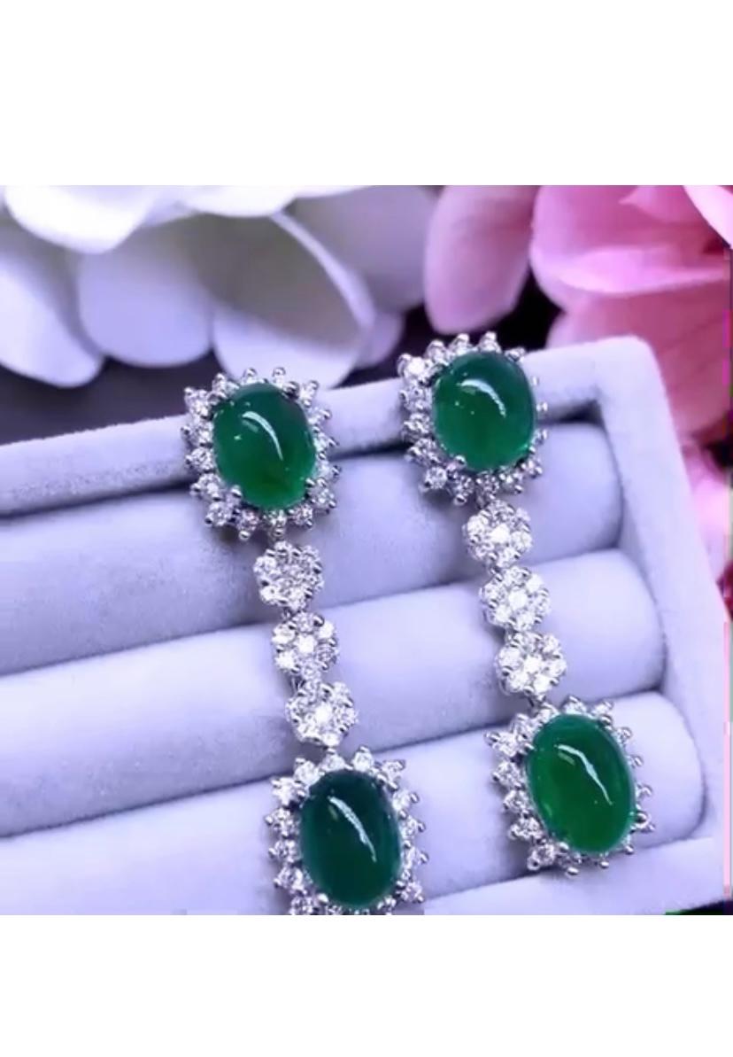 From new spring collection , magnificent earrings with a refined design and style. Do chic and glamour. Earrings come with 4 pieces of natural Zambia emeralds oval cabochon cut, fine quality, of 16,13 carats, and 106 pieces of natural diamonds,