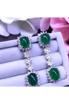 Amazing 18.88 carats of Zambia emeralds and diamonds on earrings