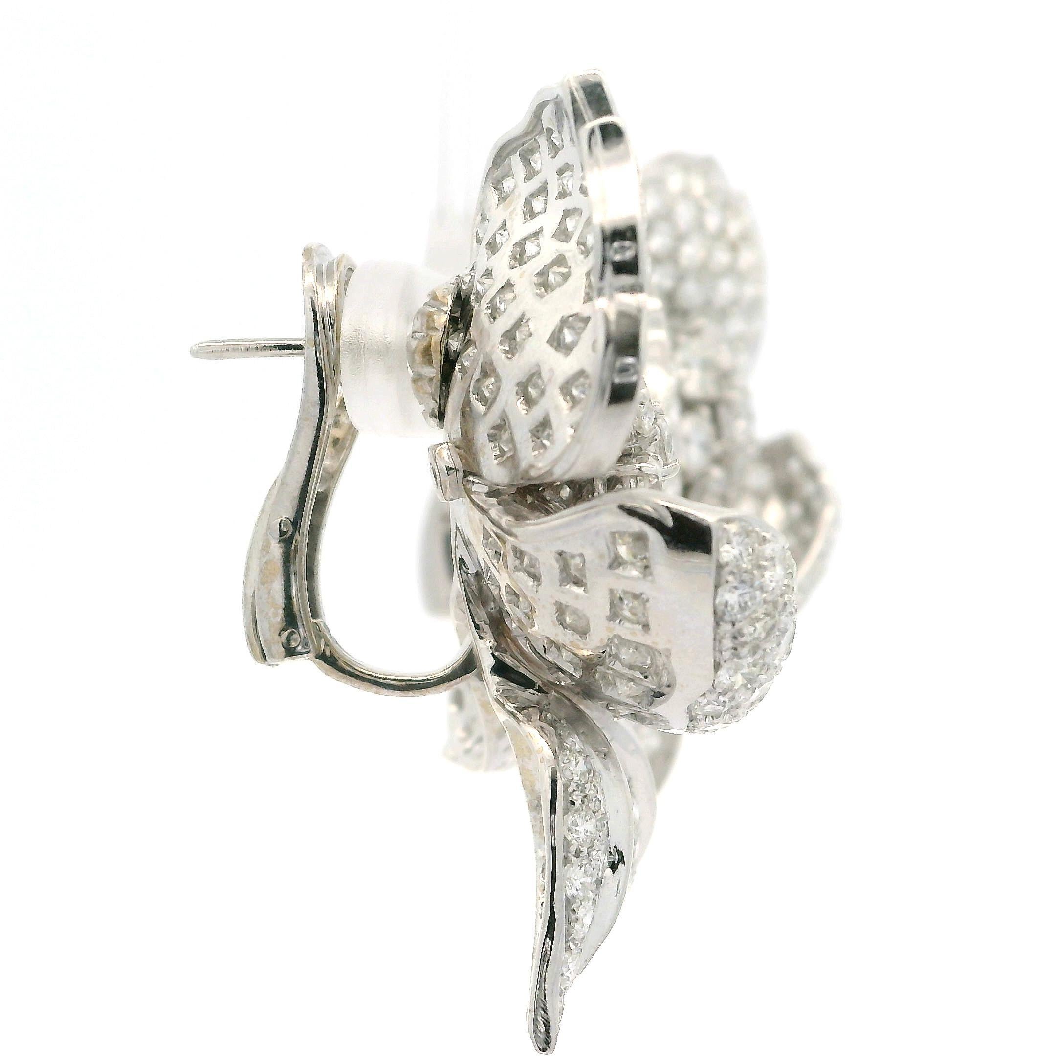 Amazing 18k White Gold 16ctw Round Diamond Covered Large Flower Omega Earrings In Excellent Condition For Sale In Montclair, NJ