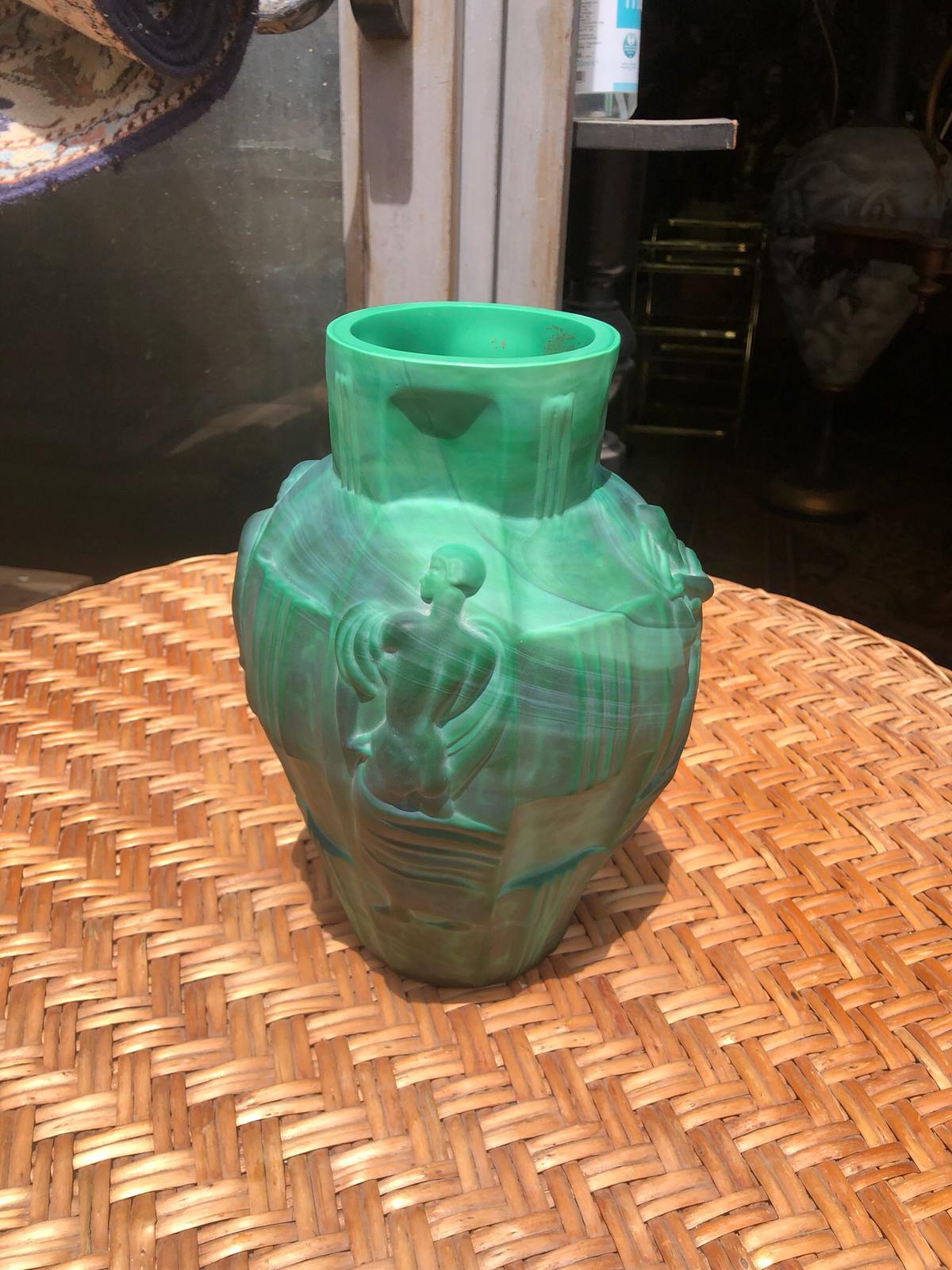 A beautiful Art Deco vase in green malachite glass by Artur Pleva for Desna Ortel, with female figures in relief. Made in Czechoslovakia, this type of vase is widely renowned in the world of glass collectors as a guarantee of high quality and