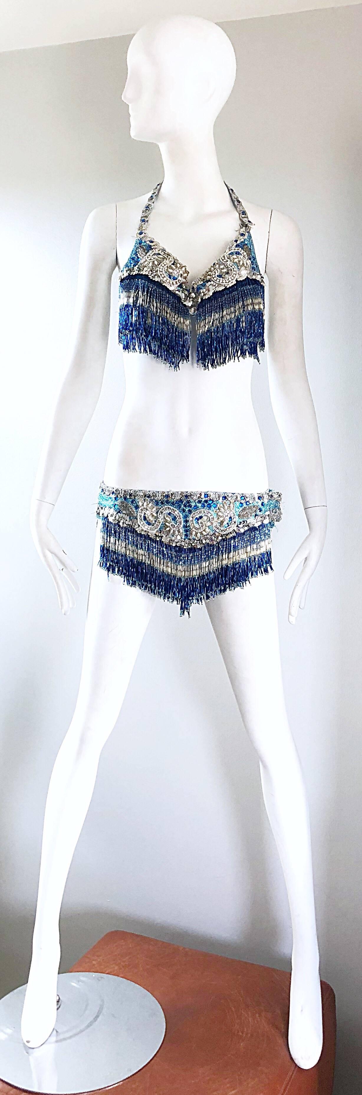 Amazing early 70s beaded, sequined and rhinestone blue and silver lurex showgirl ensemble! Features thousands of hand-sewn beads with fringe on both the bottoms and the top. Halter bra features a hidden clasp at top left shoulder and at left side of
