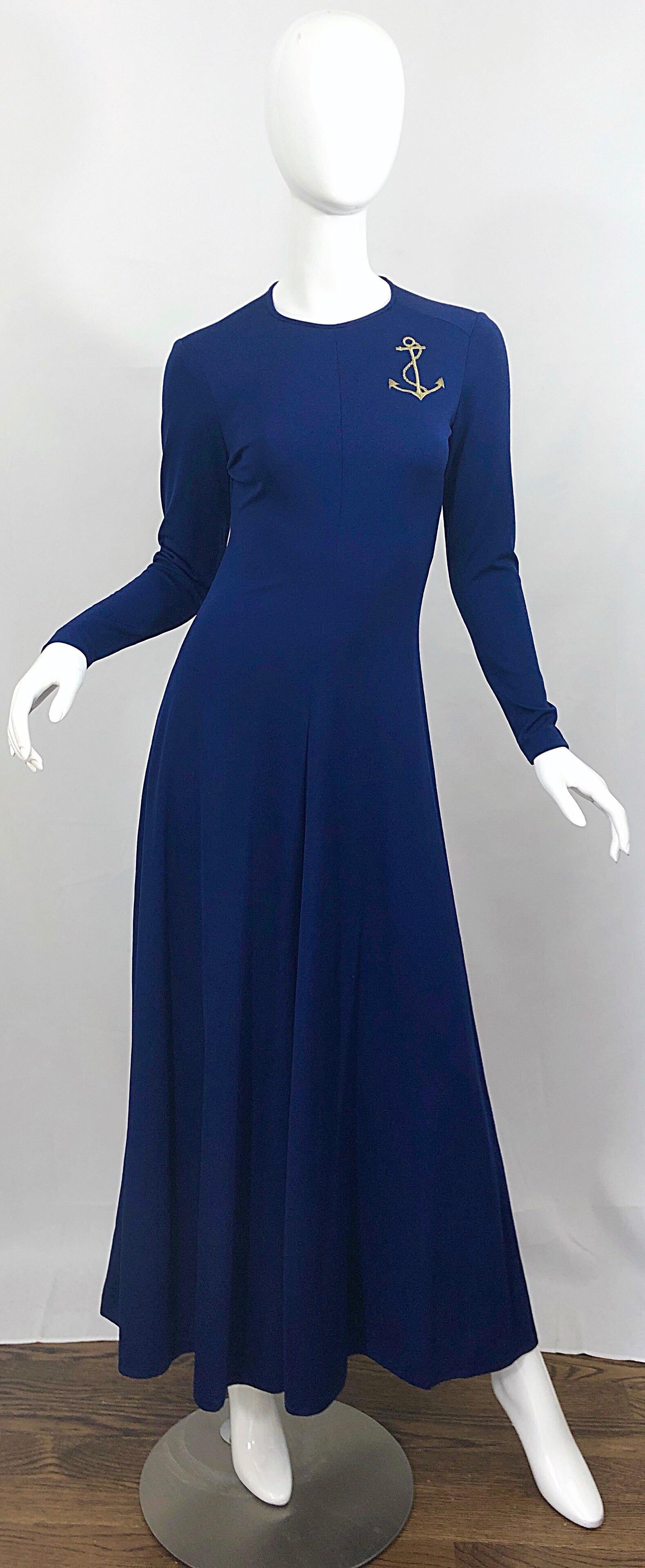 Amazing vintage 70s navy blue + gold anchor patch long sleeve jersey maxi dress! Perfect navy blue color matches anything, and is great all year. Gold anchor patch above left breast. Sleek tailored fit, with a forgiving fuller skirt. Hidden zipper
