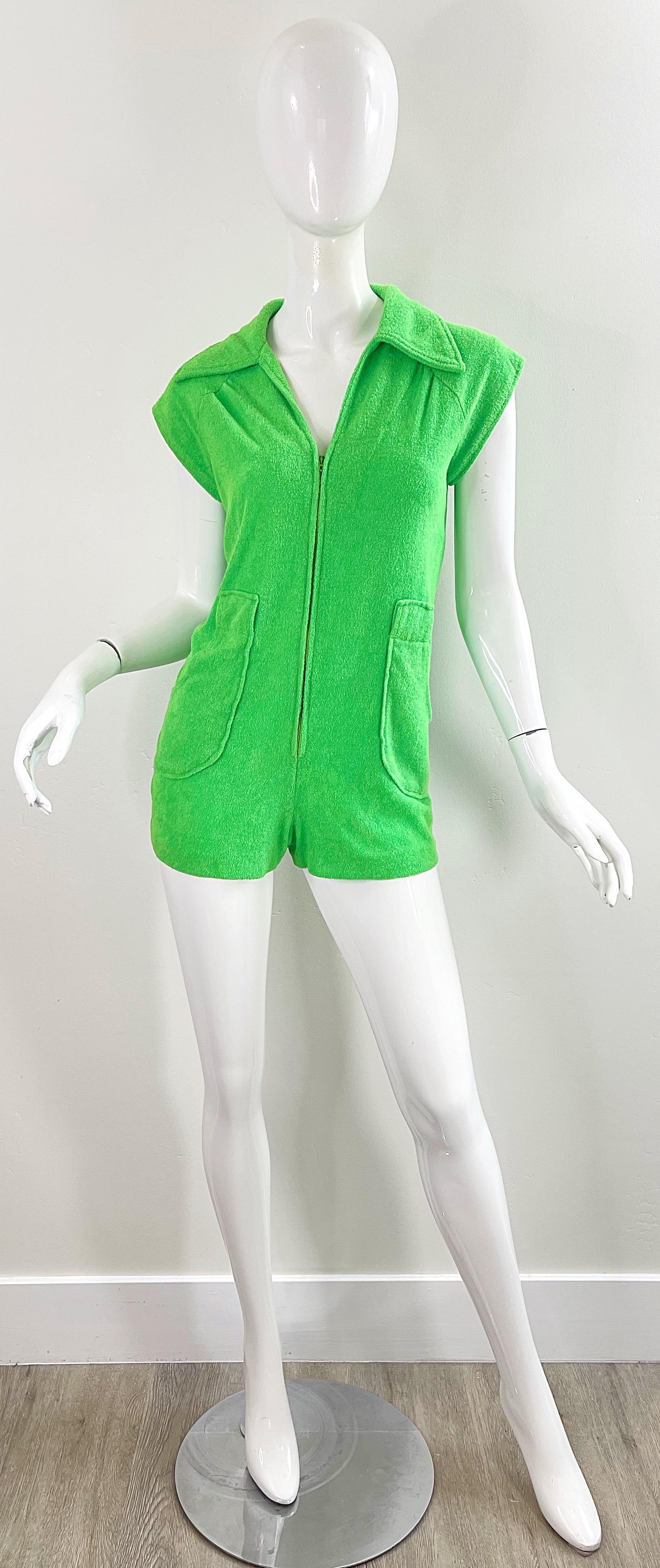 Amazing 1970s neon green terry cloth romper ! Soft terrycloth fabric has some stretch. Hidden zipper up the front, with pockets at each side of the waist. 
Pair with wedges, flats, sandals, heels or boots.
In great condition 
Approximately Size