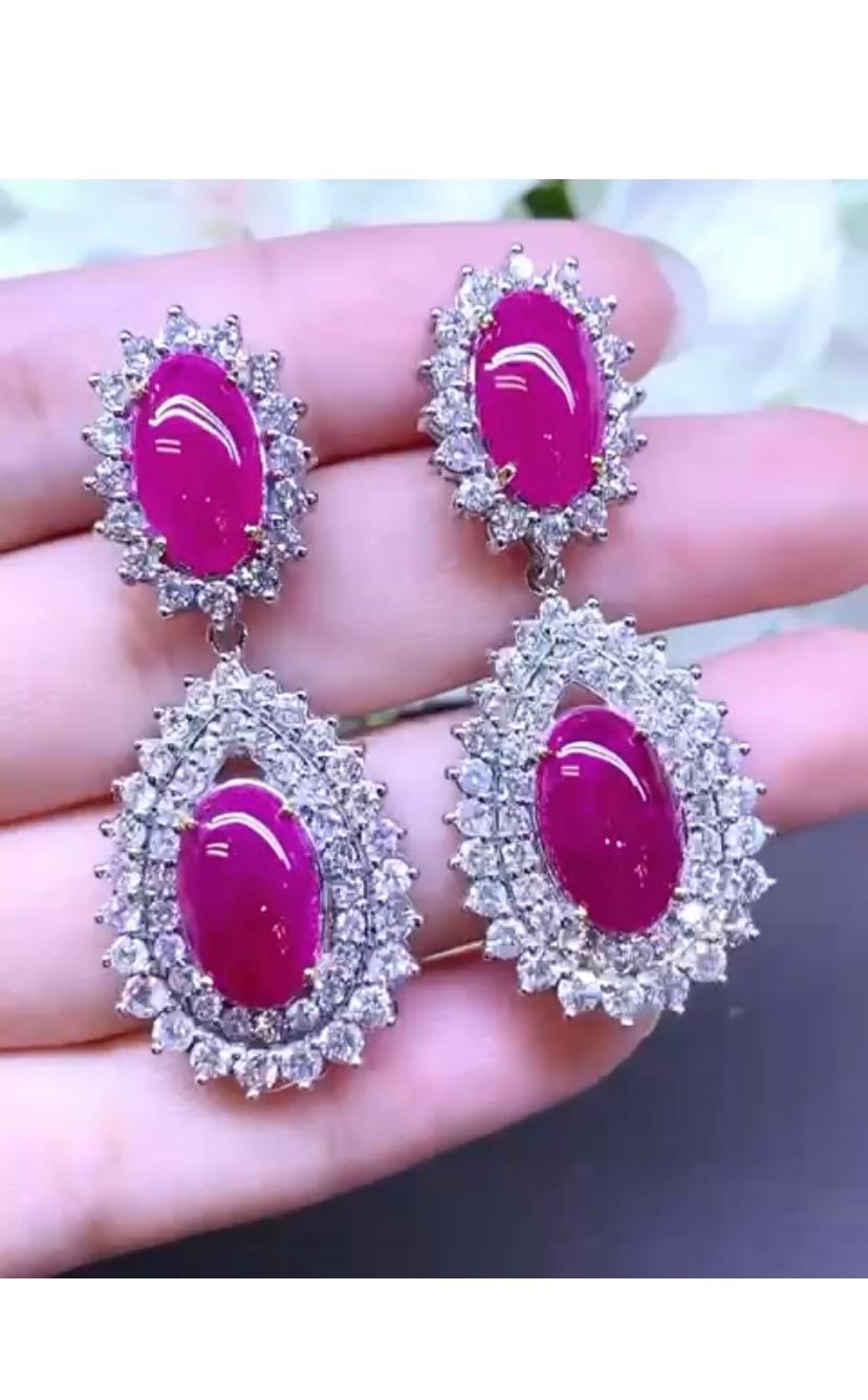 So stunning design for this contemporary earrings, so modern, glamor , ideal for all important events.
Earrings come in 18k gold with 4 pieces of  Natural Burma Rubies, fine quality, in perfect  cabochon cut ,of 19,00 carats and round brilliant cut