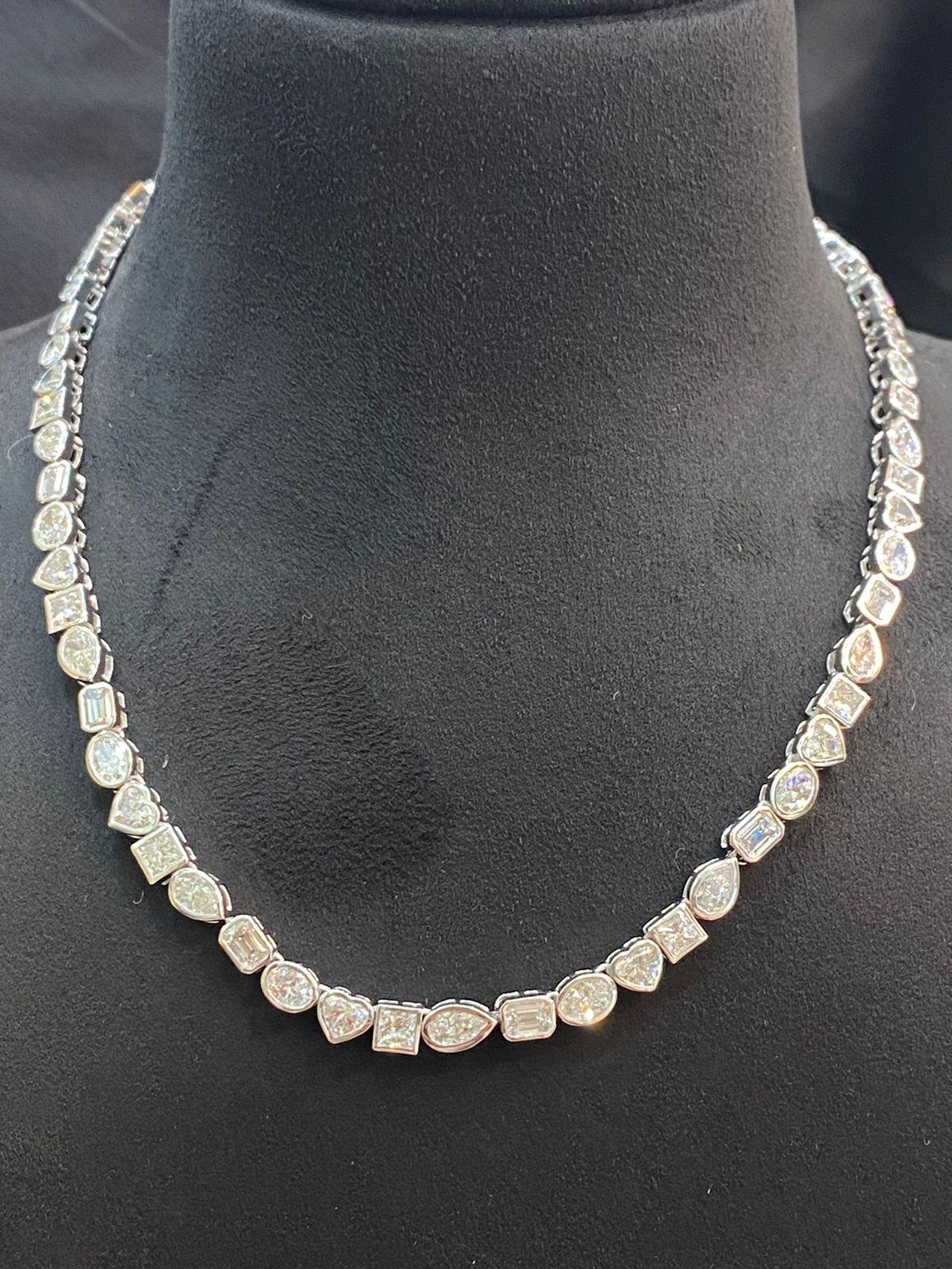 A stunning exclusive tennis necklace, so contemporary and modern design, perfect for all events and for everyday.
Necklace come in 14k gold with Natural Diamonds in perfect special cut , oval , heart , princess, pear, emerald, of 27,00 carats, G