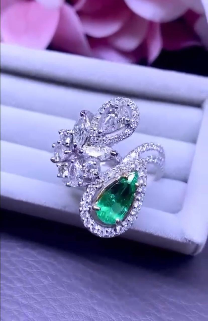 An exquisite design, so chic and elegant, a very piece of art, handmade , so very sparkly and glamour piece.
Ring come in 18k gold with a natural Colombian Emerald of 1,06 ct ,  fine quality and grade , and a pear cut diamond of 0,40 carats, and
