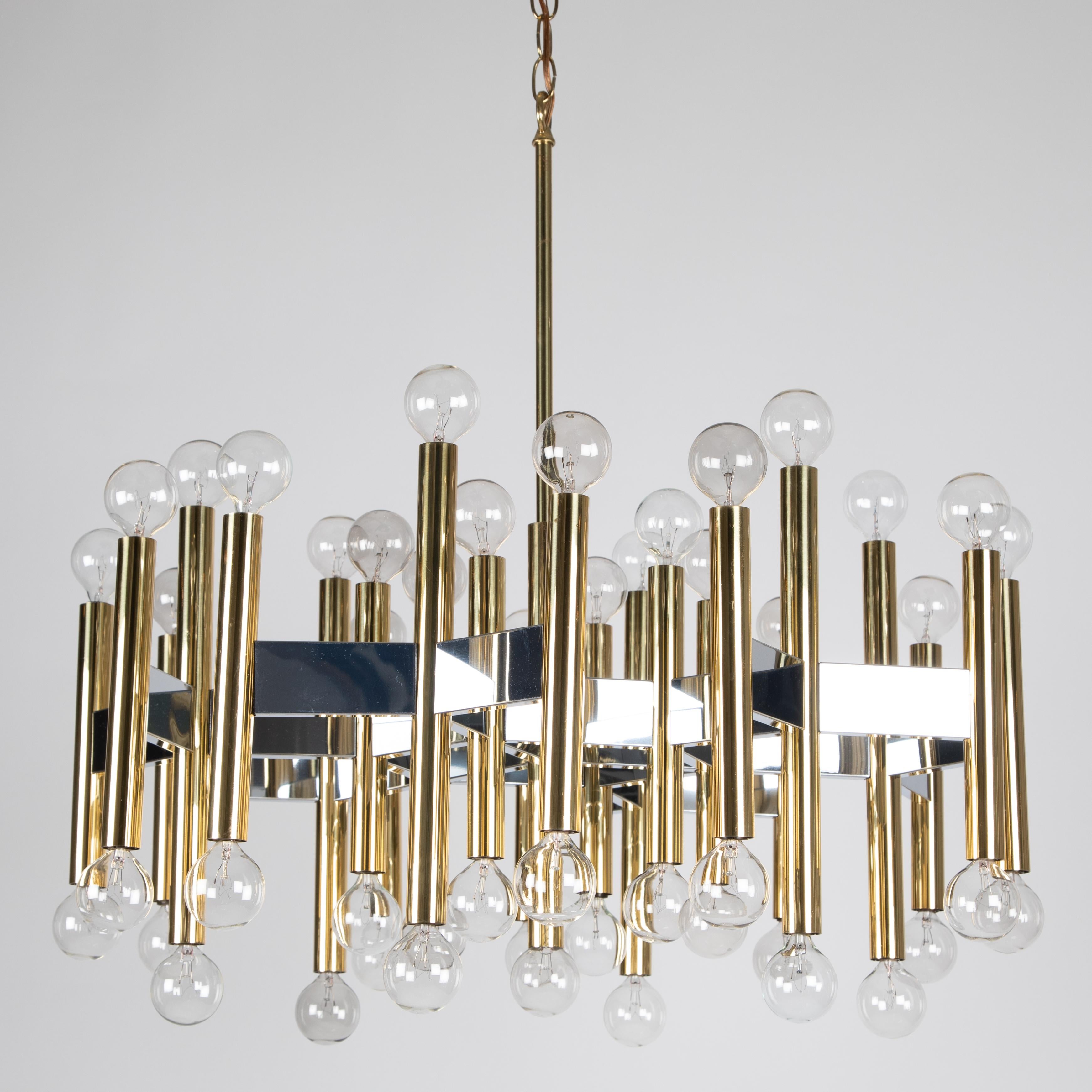 Stunning 1960s brass and chrome geometric chandelier by Gaetano Sciolari with an incredible 49 sockets. Complete with original ceiling canopy.


