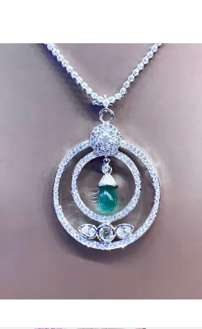 An exquisite design, so refined and chic, for this pendant , very elegant design .
Pendant come in 18k gold with a Natural  Zambian Emerald of 3,30 carats, in perfect cabochon cut ,fine quality, and natural diamonds of 3,30 carats,F/VS , top
