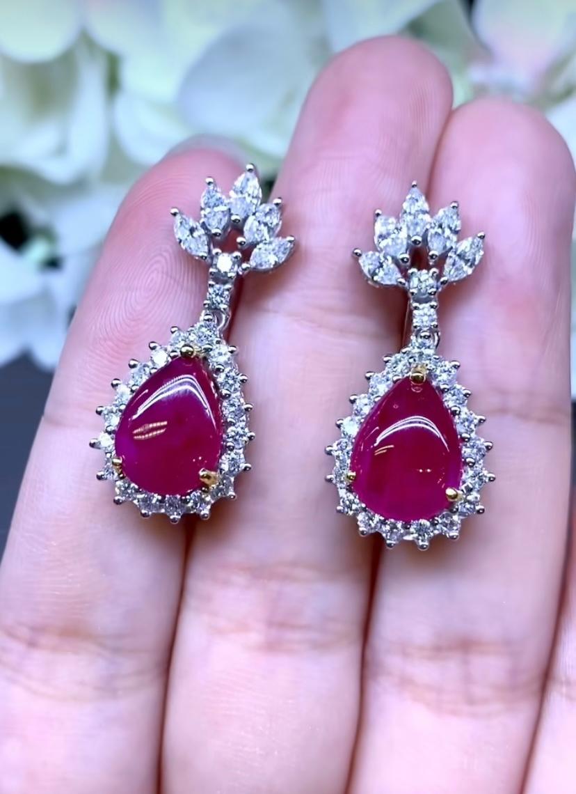 An exquisite design for this refined and chic earrings in 18k gold, with two pieces of Burma rubies, cabochon cut, fine quality, very stunning color , of 6.50 carats, and special cut diamonds of 2.11 carats, F/VS, top quality.
Handcrafted by artisan
