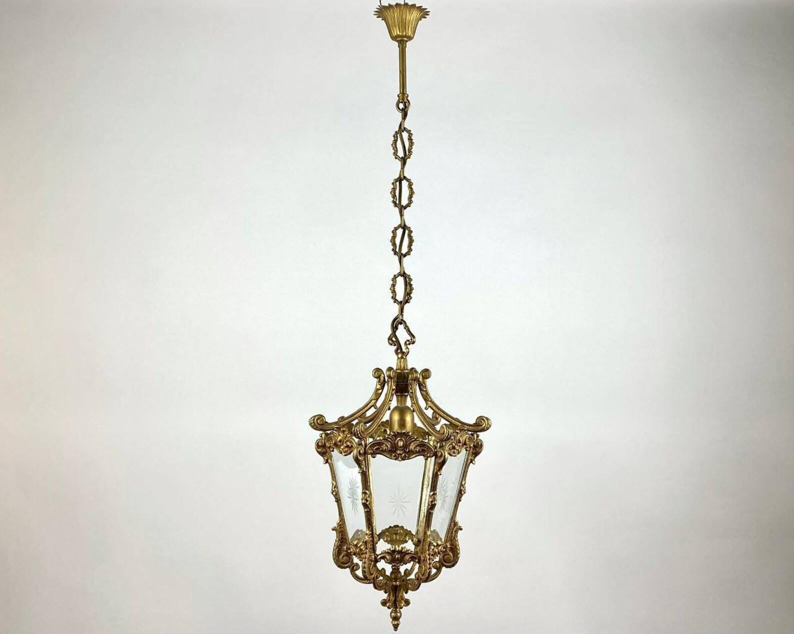 Large antique 6 sided lantern. Empire Style Lantern, France, 1920s.

 Decorate your ceiling with French bronze lantern of early 20th century. 

 The 6 sides have 6 transparent and curved glass windows which are hand engraved.

 The frame is a