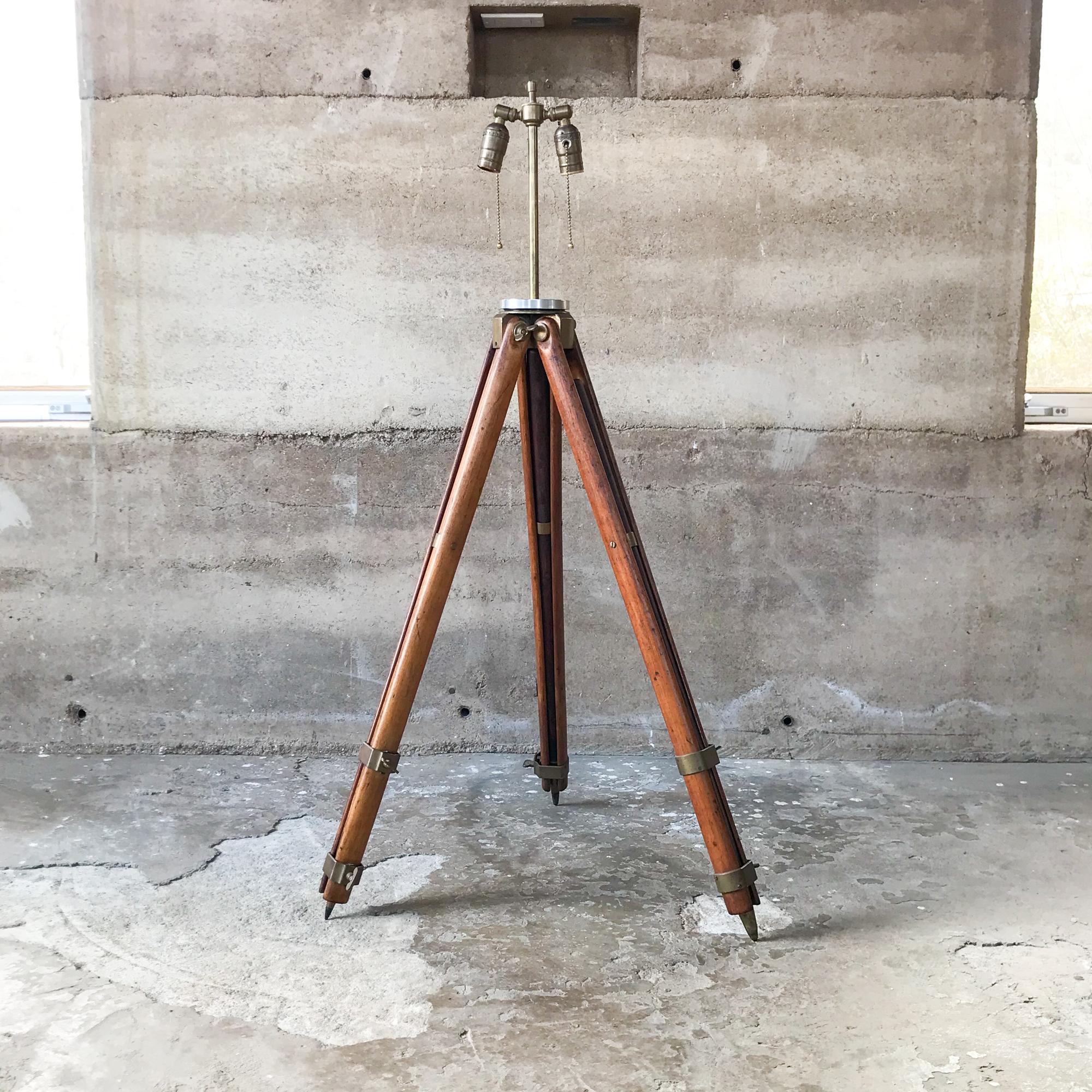 Good looking antique up-cycled architect's engineering floor lamp with vintage tripod surveying base. Two sockets with pull chains. Fabulous plus clever piece!
Surveyor base is vintage antique oak and brass transit tripod surveyor attributed to W &