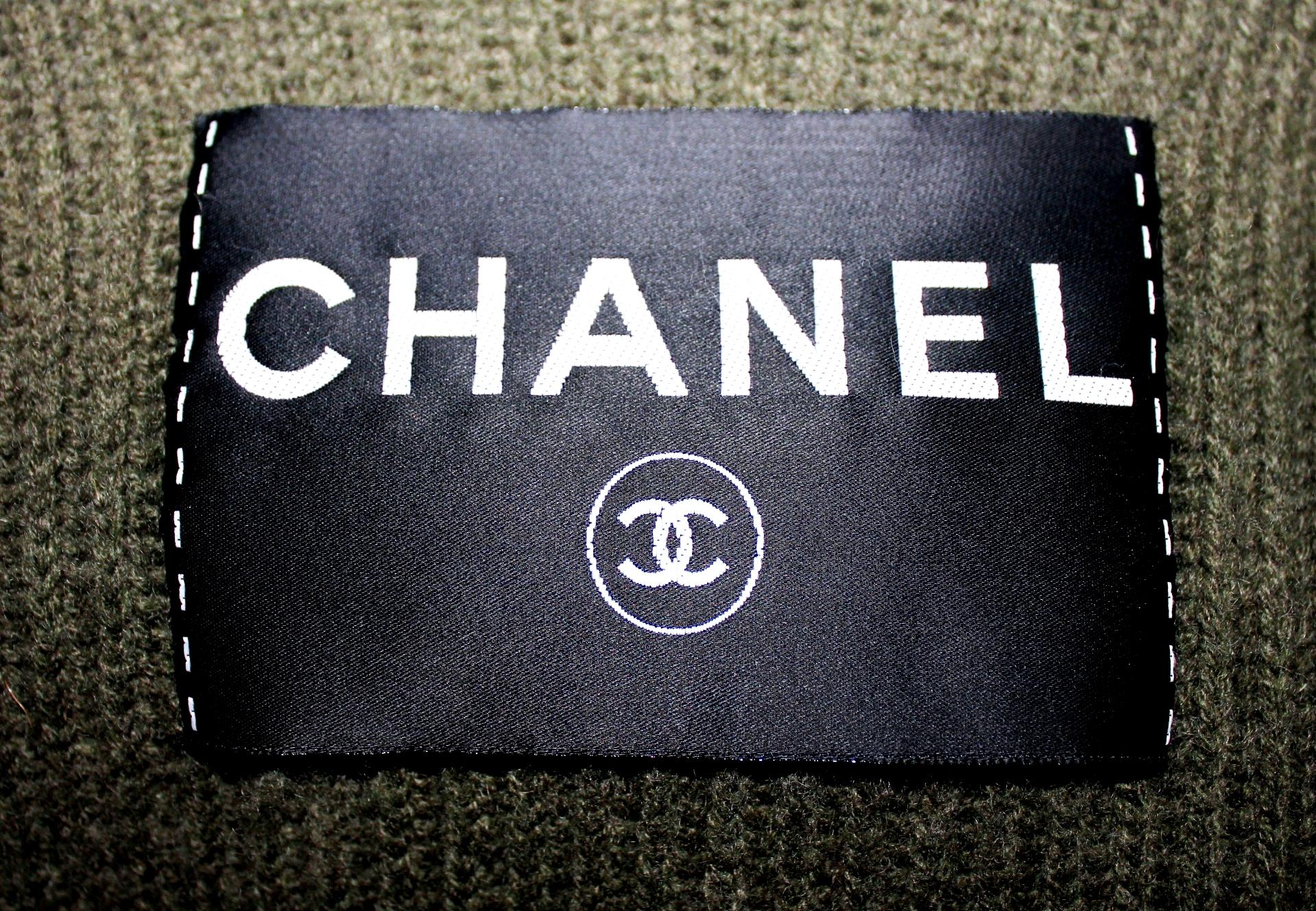 Stunning Chanel Dress
Finest pure olive cashmere wool
With huge Chanel logo tag in front
A CHANEL siganture piece created 
Featured in the CHANEL AD campaign, editorials
A similar version of this dress in navy was seen on Pamela Anderson
A very