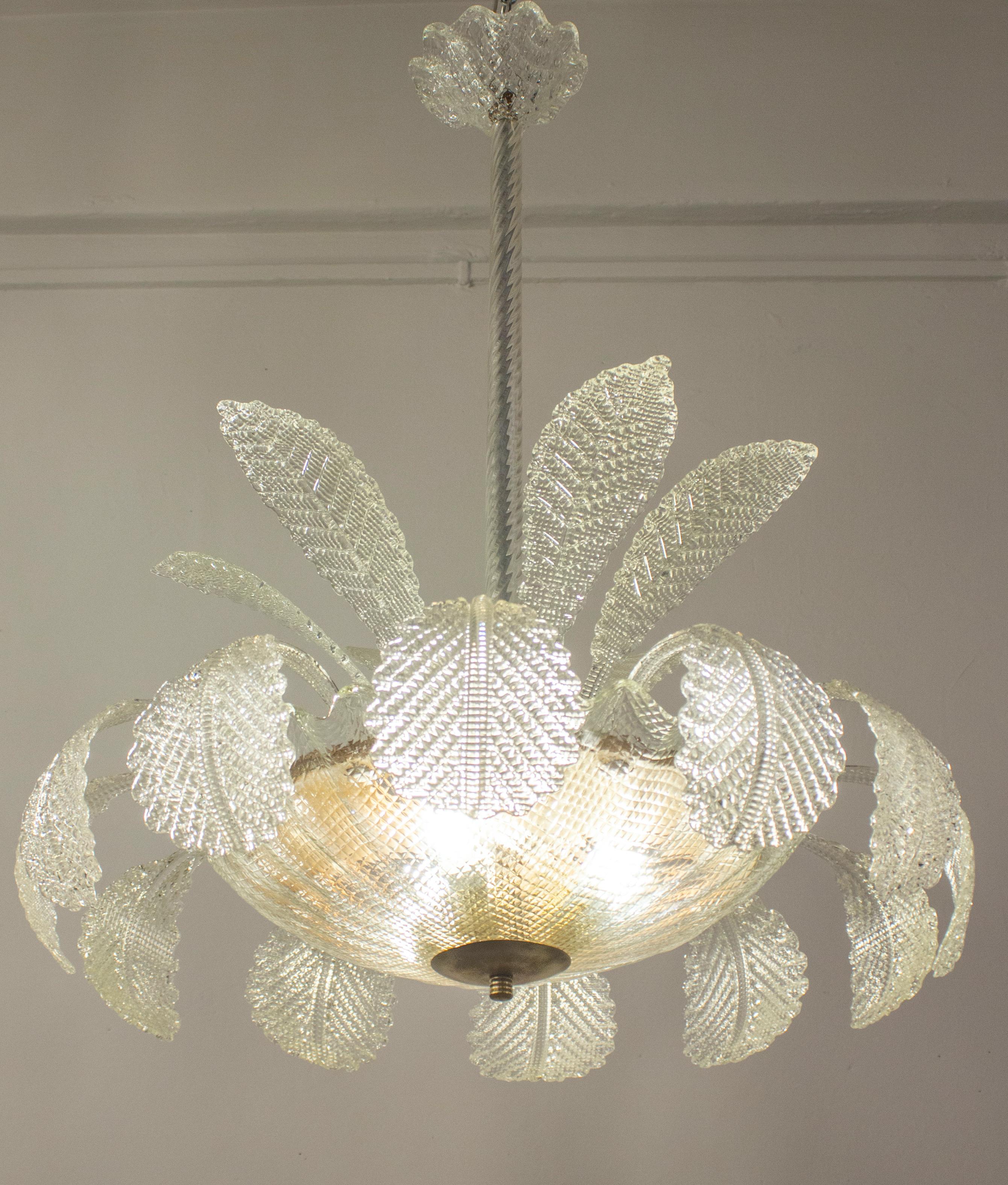 Charming hand blown Murano glass chandelier by Ercole Barovier.
Excellent vintage condition.
Three E 27 light bulbs.
Cleaned and re-wired, in full working order and ready to use. In excellent vintage condition. The leaves, all original and in good