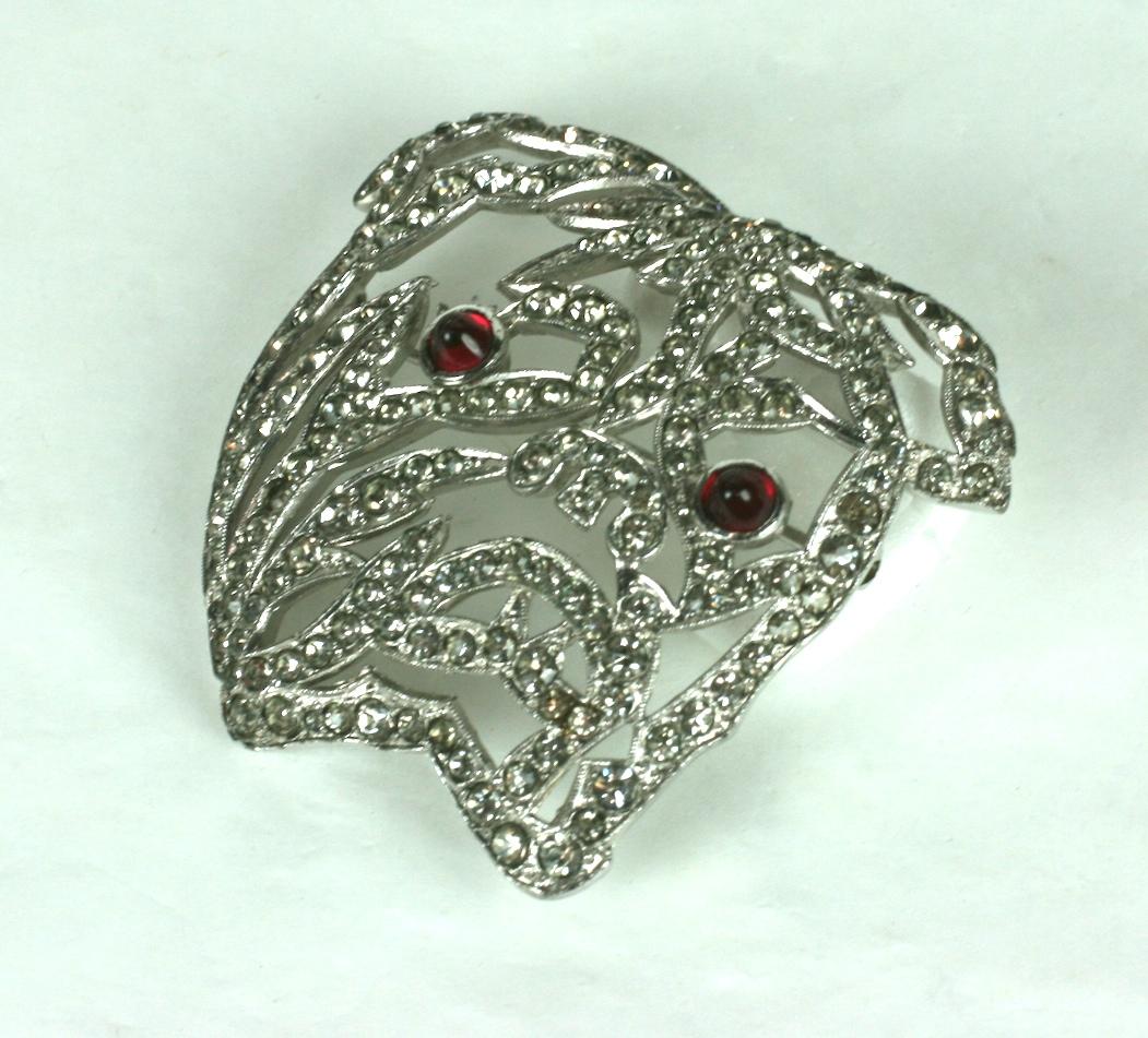 Amazing Art Deco Trifari Bulldog Brooch from the 1930's by Alfred Phillipe.  Pave accented pierced openwork design with ruby glass cab eyes. This brooch works best on a dark base to highlight the open work. Pure Art Deco Stylings. 2.25