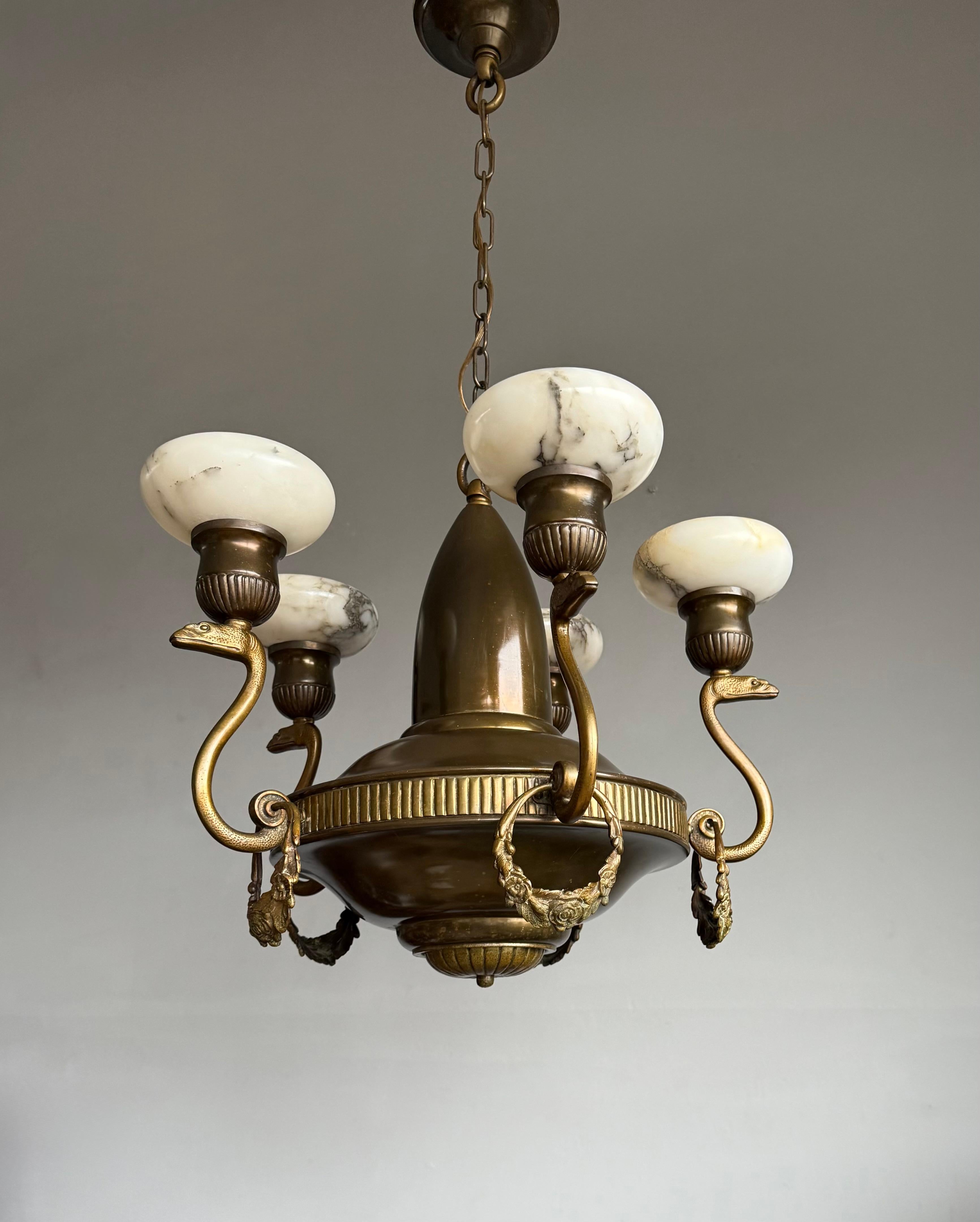 Good size and remarkable, antique bronze and brass five-arms snake pendant light.

This rare and remarkable five-light chandelier is yet another recent great find and offering such a piece in our gallery always is a point of pride. Step into a world