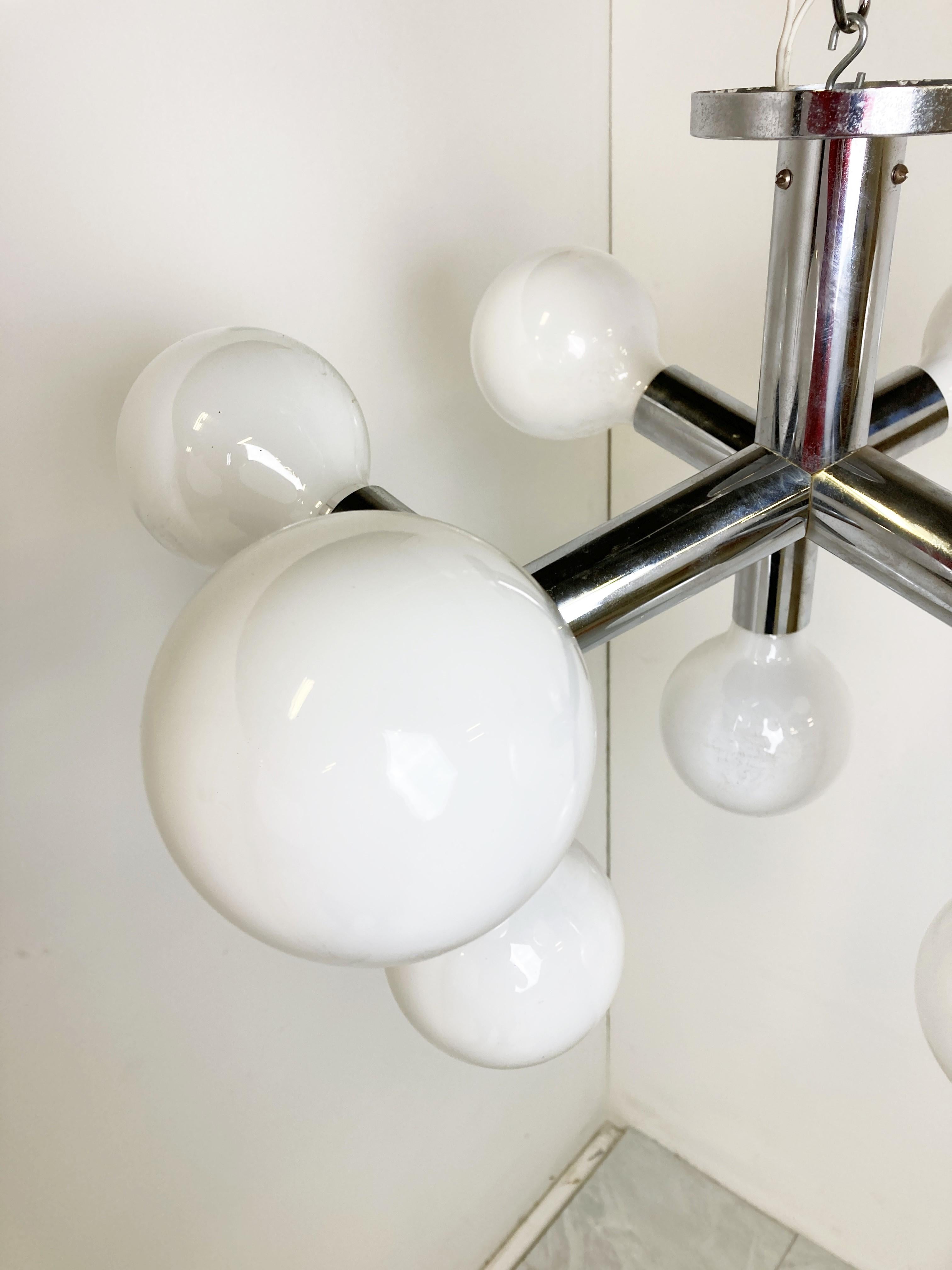 Space age sputnik / atomic chandelier designed by JT Kalmar.

Beautiful timeless design with tubular chrome arms and globe lightbulbs. 

We will supply the light bulbs unless based in a location that doesnt use 230v. (as they wont work on 110v