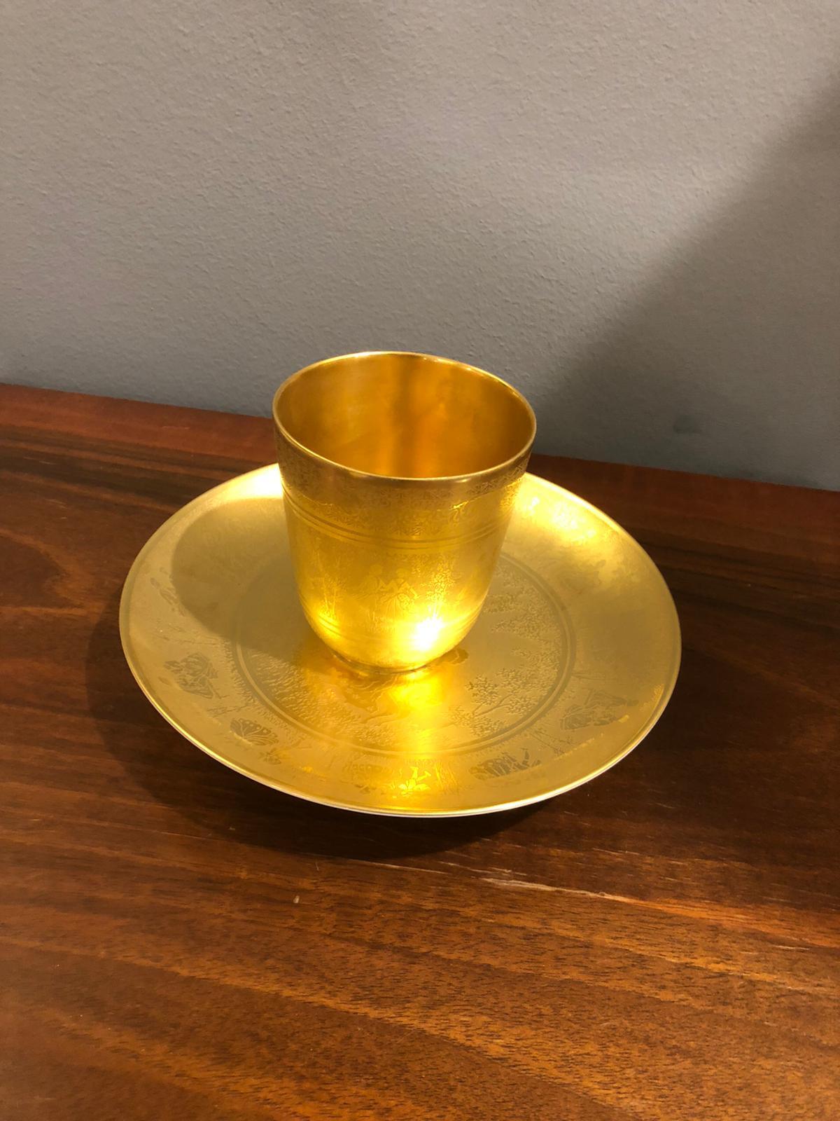 Beautiful set decorated with romantic themes and worked with pure gold. Logo printed on the bottom of both the plate and the cup. Perfect conditions.