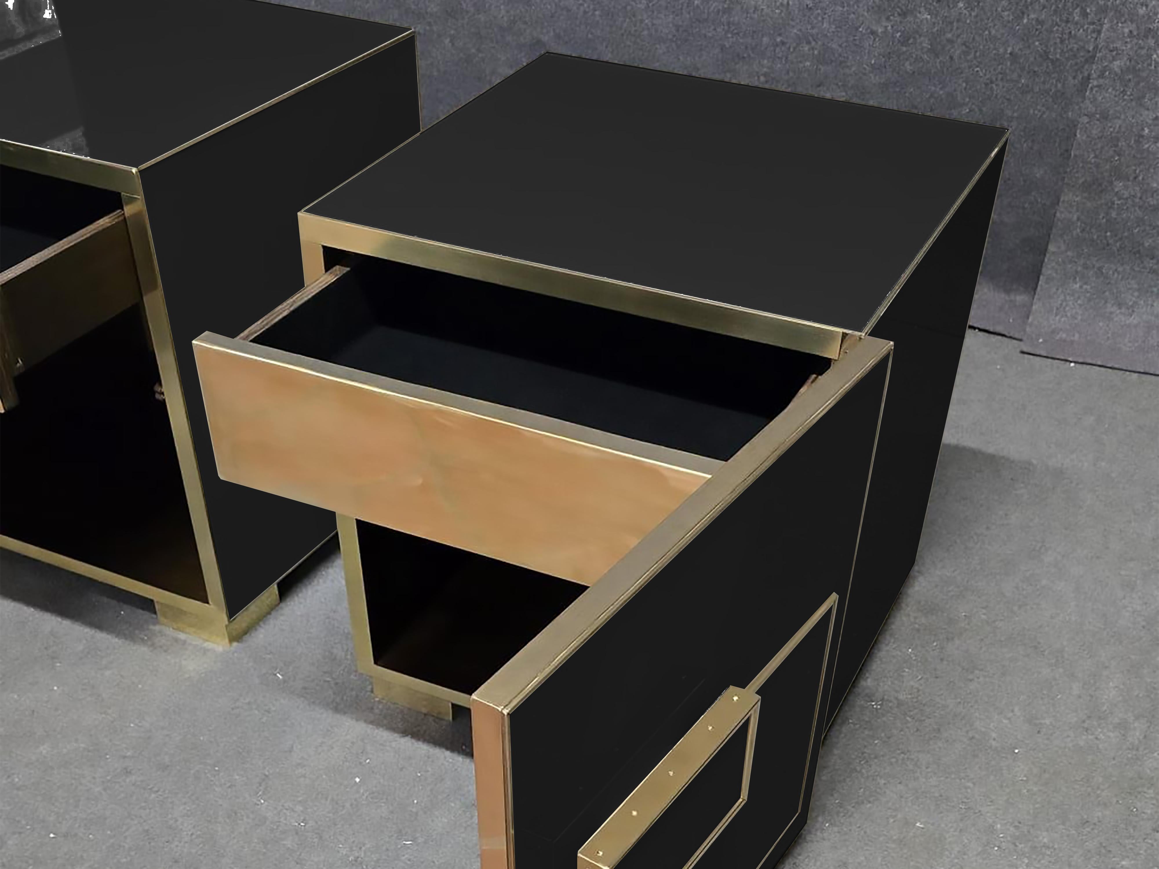 This Black Murano Glass & Brass nightstands are an extraordinary fusion of Italian artistry and modern design.

Expertly crafted from elegant black Murano glass, these bedside tables exude a profound elegance that reflects both craftsmanship and