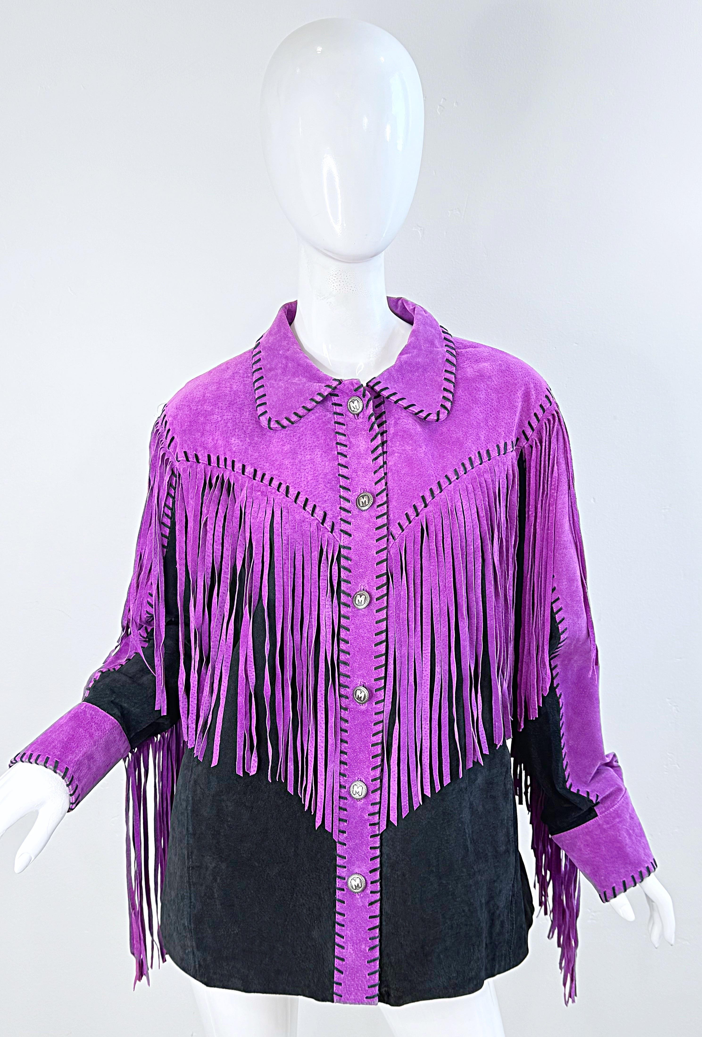 Amazing early 1990s Bob Mackie purple and black suede fringe jacket ! Features fringe across the front and back. Silver logo buttons snap close. Pockets at each side of the waist.
In great condition
Marked Size Large
Measurements:
46 inch bust
46