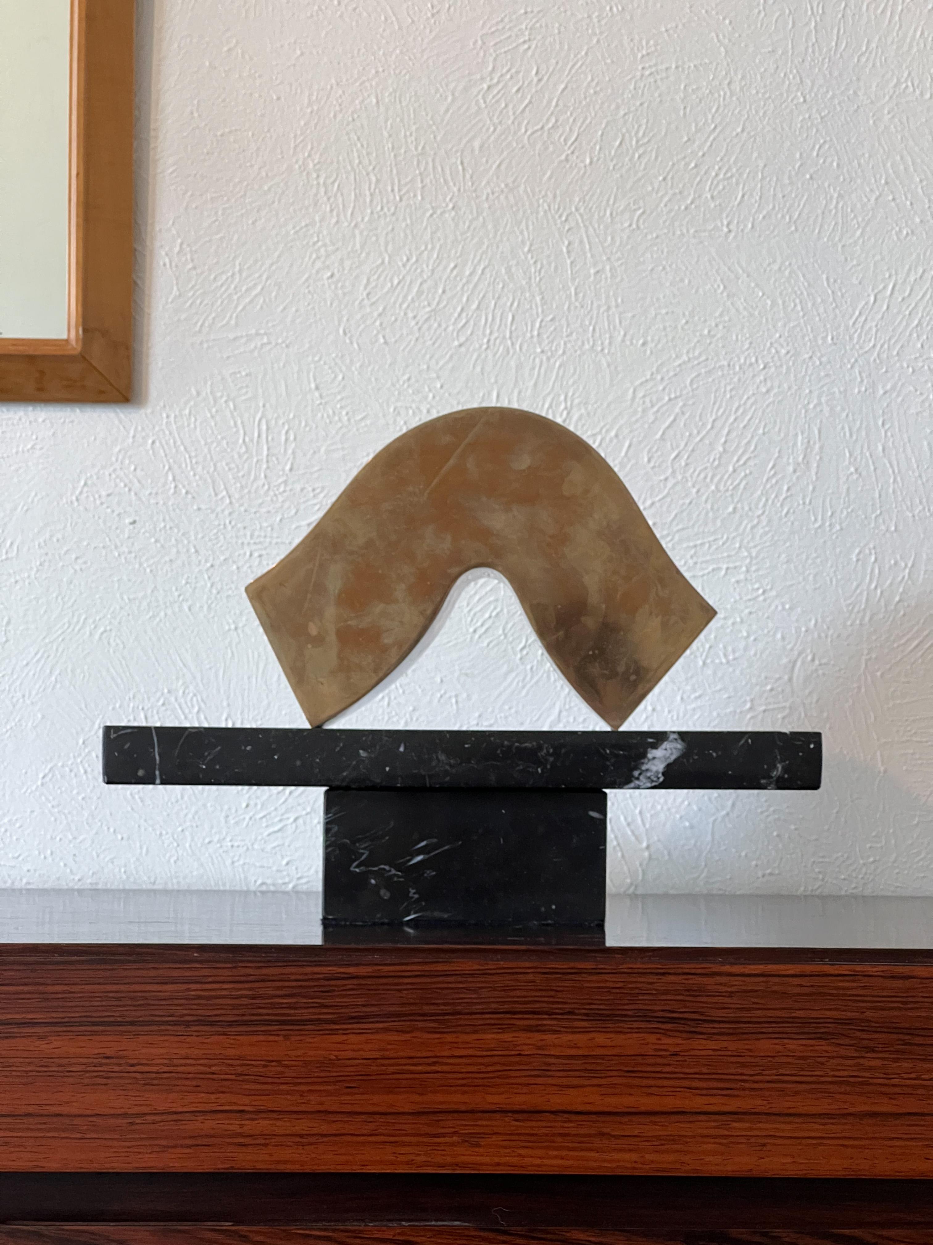 Signed, dated and numbered abstract bronze and marble sculpture by listed Utah artist Neil Hablock, Circa, 1984. Abstract bronze form on top of black marble stand can be left up to interpretation. 

Bio : Neil Hadlock spent his boyhood in Idaho,