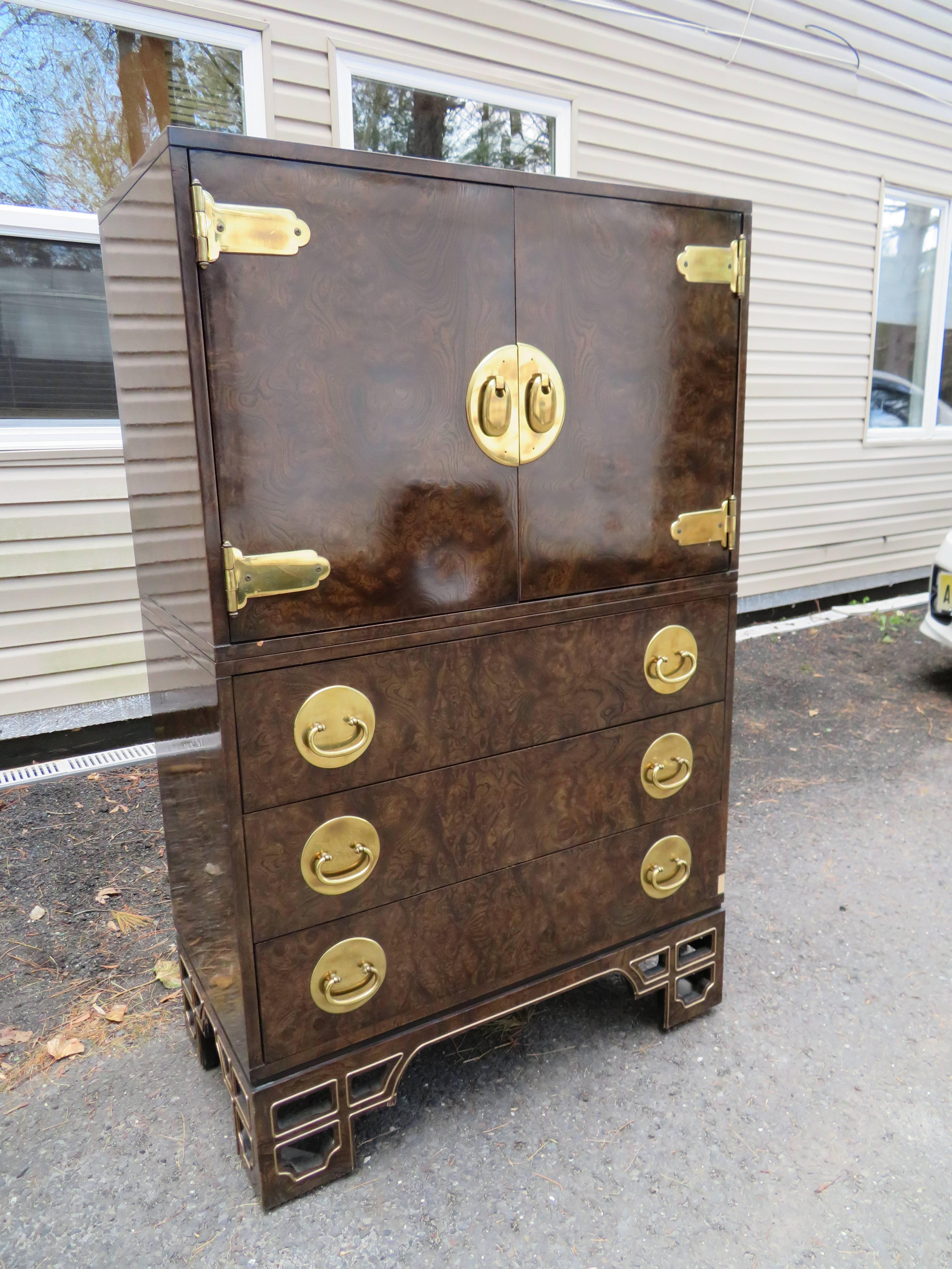 Amazing burled amboyna and brass two-piece chinoiserie Mastercraft tall dresser. Wow! is what you will say when you see this stunning two-piece tall dresser-made in two sections for easy moving. This piece is in fabulous vintage condition and would