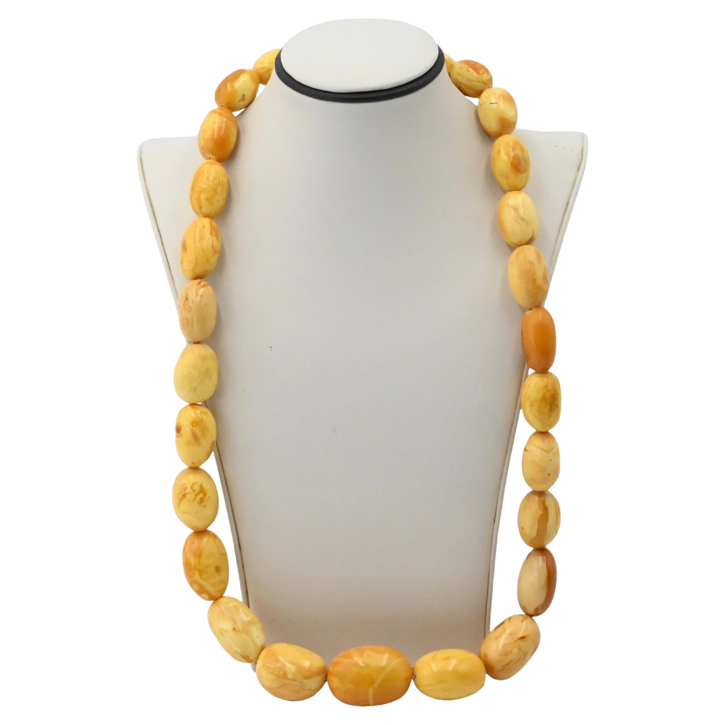 Lot 308 - A beaded faux butterscotch amber necklace,