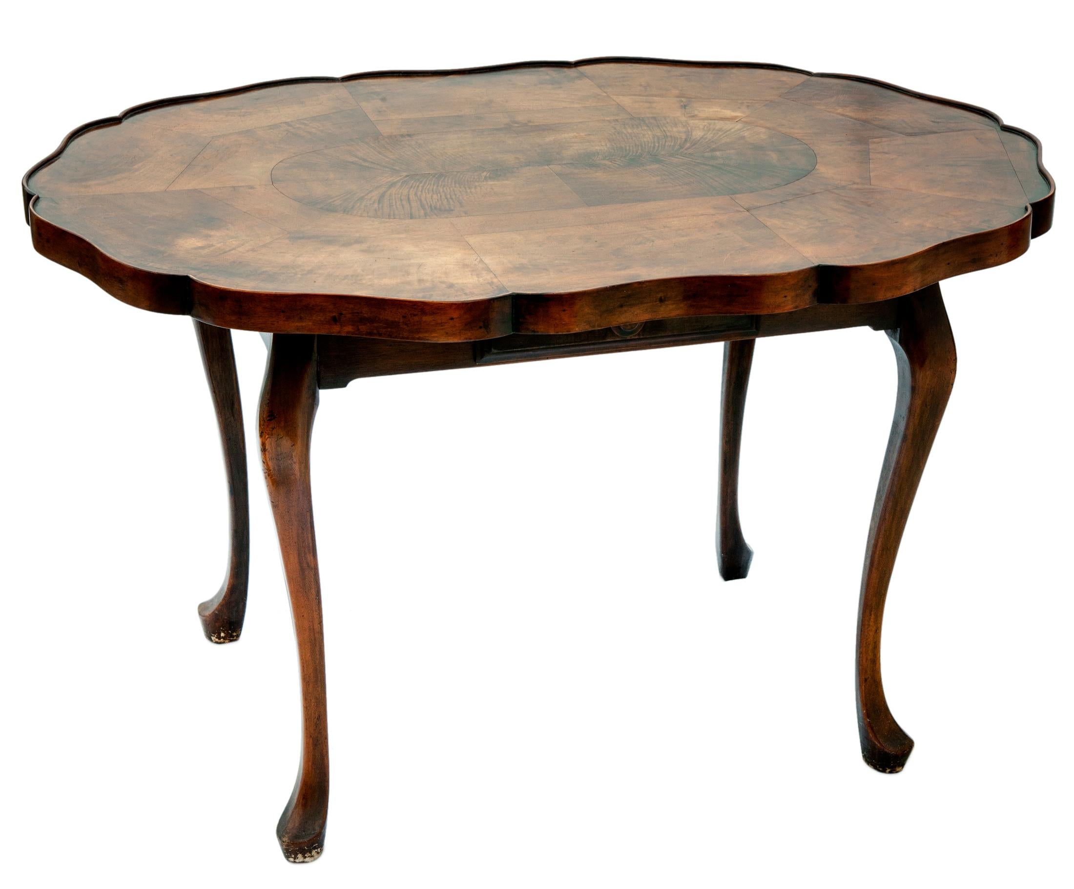 Burl Walnut Center Table/ Writing Desk
Stunning Queen Anne style center table/writing table hand made in walnut with dramatic burled venneers.
Fine craftsmanship with a 1.75