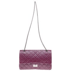 Amazing Chanel 2.55 Reissue handbag in plum quilted leather