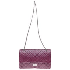 Amazing Chanel 2.55 Reissue handbag in plum quilted leather