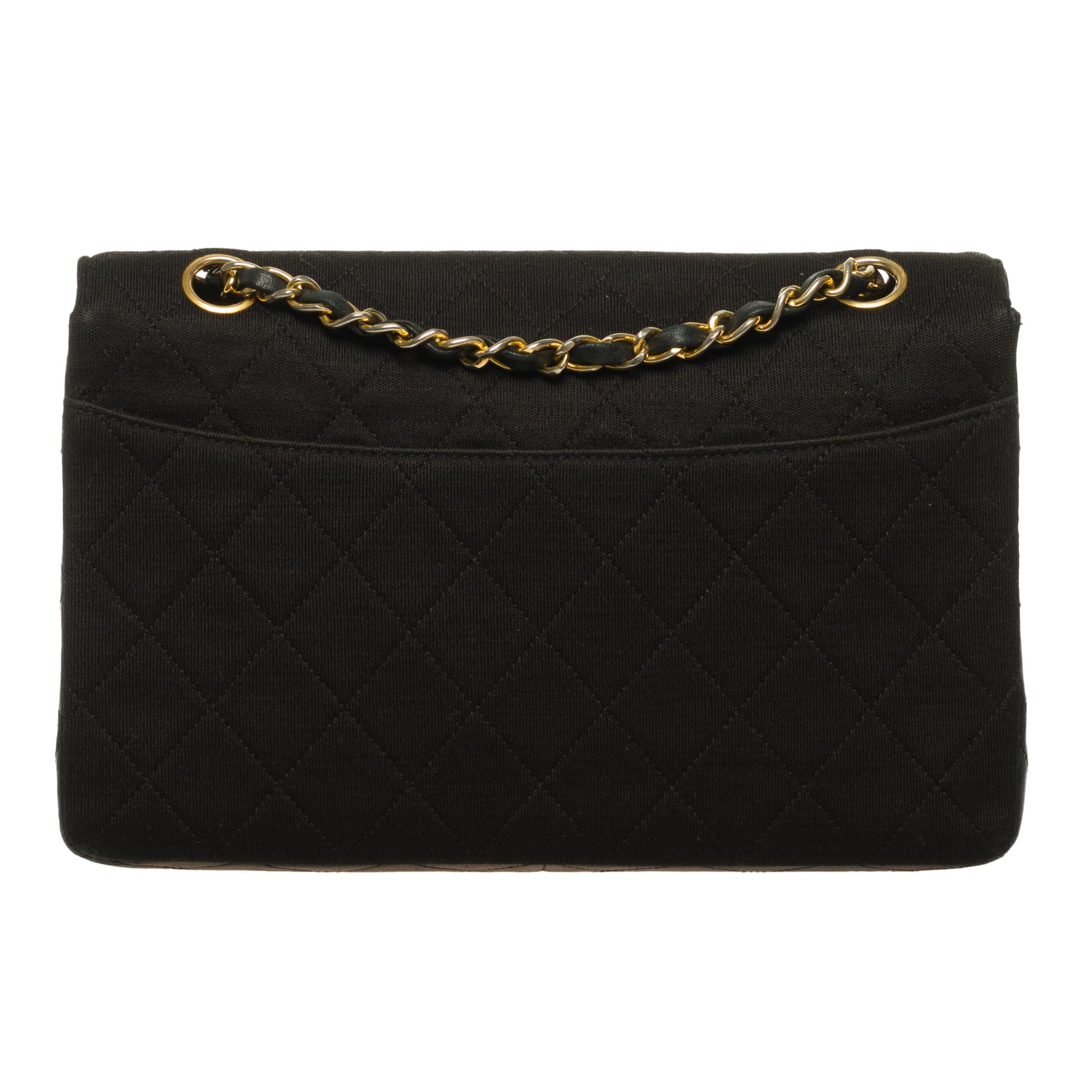 Lovely Chanel Crossbody bag, single Flap Bi-Material Vintage with wallet.

* Quilted leather and black jersey, gold-tone metal trim
* With his black leather wallet.
* With its authenticity card
* Hologram present but not visible
* Gold-tone metal