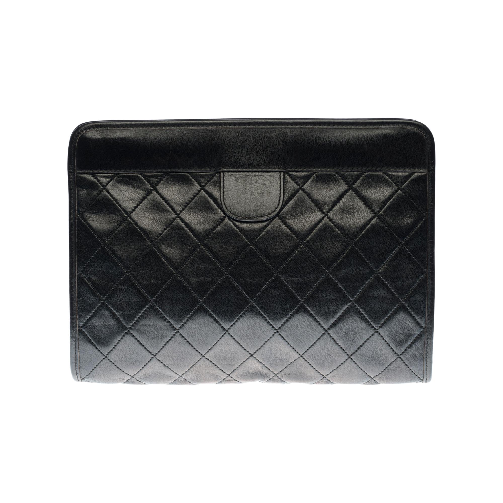 Lovely Chanel Hand Clutch/Clutch Pouch in black quilted lambskin leather, gold plated metal hardware for a handheld

Opening from the top to the top, hinges at the extremes
Gold-tone metal CC logo on black leather tab at front, black leather tab at