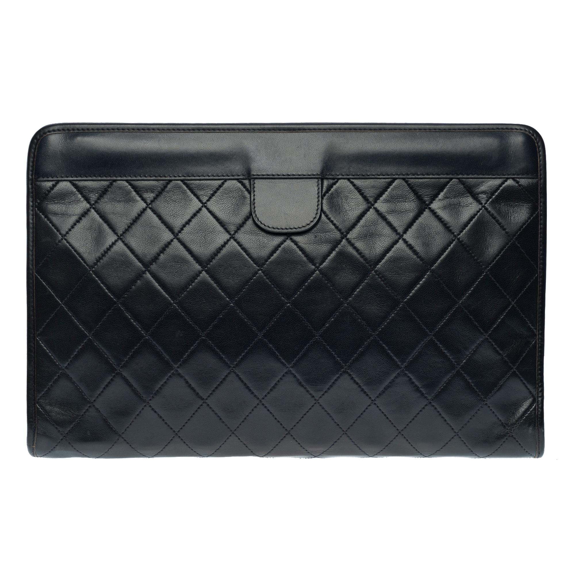 Lovely Chanel Hand Clutch/Clutch Pouch in black quilted lambskin leather, gold plated metal hardware for a handheld

Opening from the top to the top, hinges at the extremes
Gold-tone metal CC logo on black leather tab at front, black leather tab at