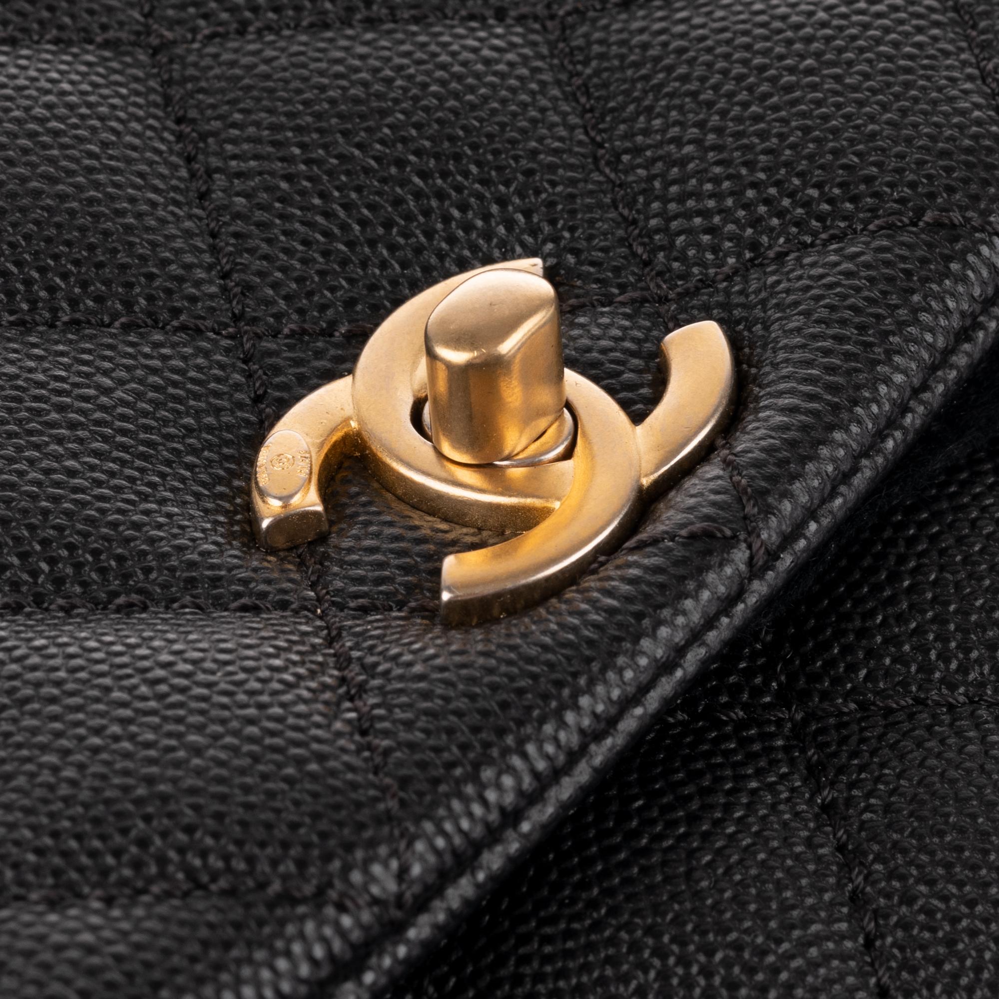 Black Amazing Chanel Coco handbag in black caviar leather, handle in brown lizard !