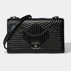 Amazing Chanel Coco shoulder flap bag in black quilted leather, ASHW