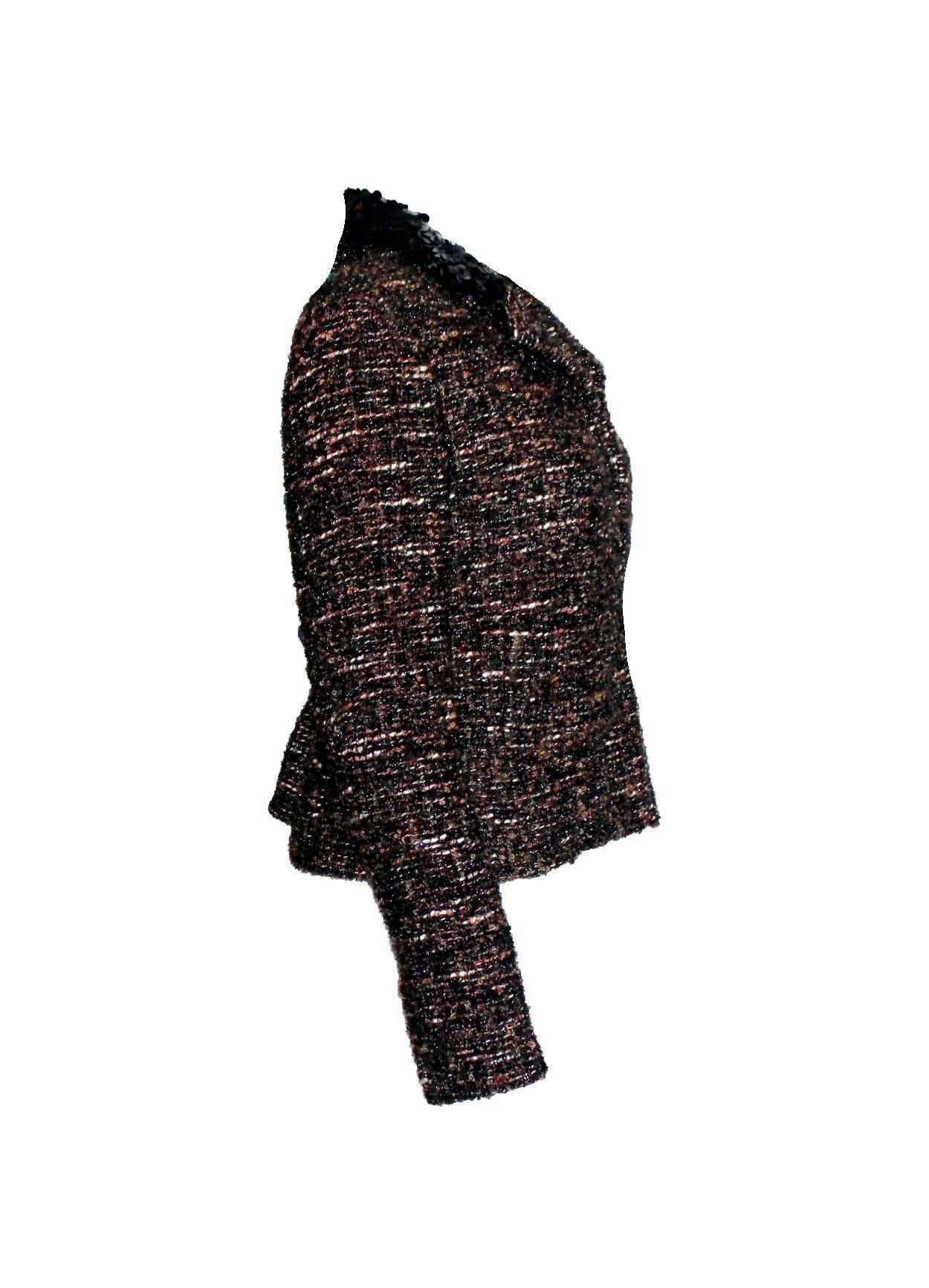 Beautiful CHANEL fantasy tweed jacket designed by Karl Lagerfeld
A true CHANEL signature item that will last you for many years
Closes in front with concealed hooks
Amazing metallic tweed fabric
Beautiful buttons on sleeves with real button holes