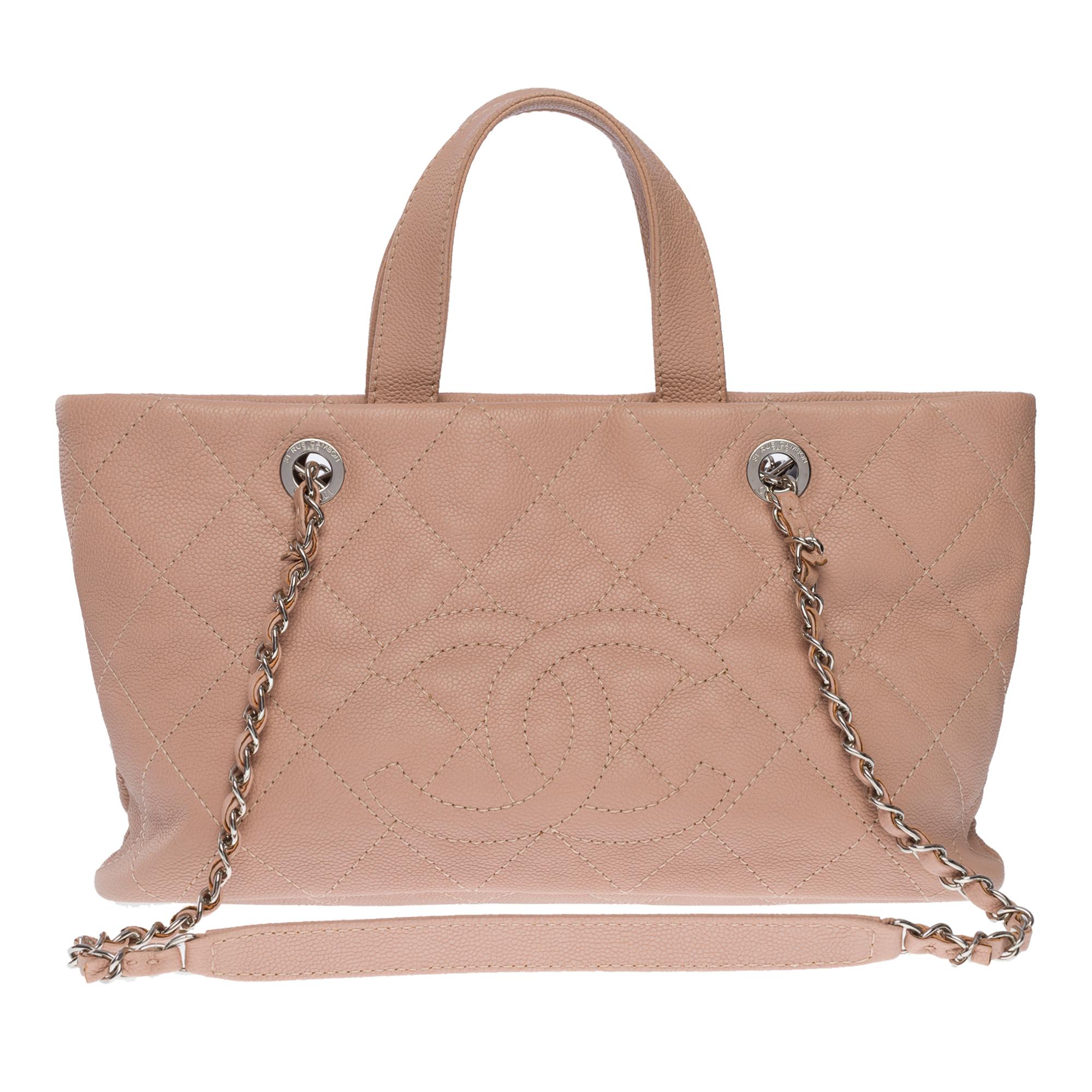 Gorgeous Chanel Mini shopping Tote bag in pink caviar leather, silver metal hardware, double pink leather handles and a silver metal chain handle interwoven with pink leather for a hand and shoulder support

Closure by silver magnet
A zippered