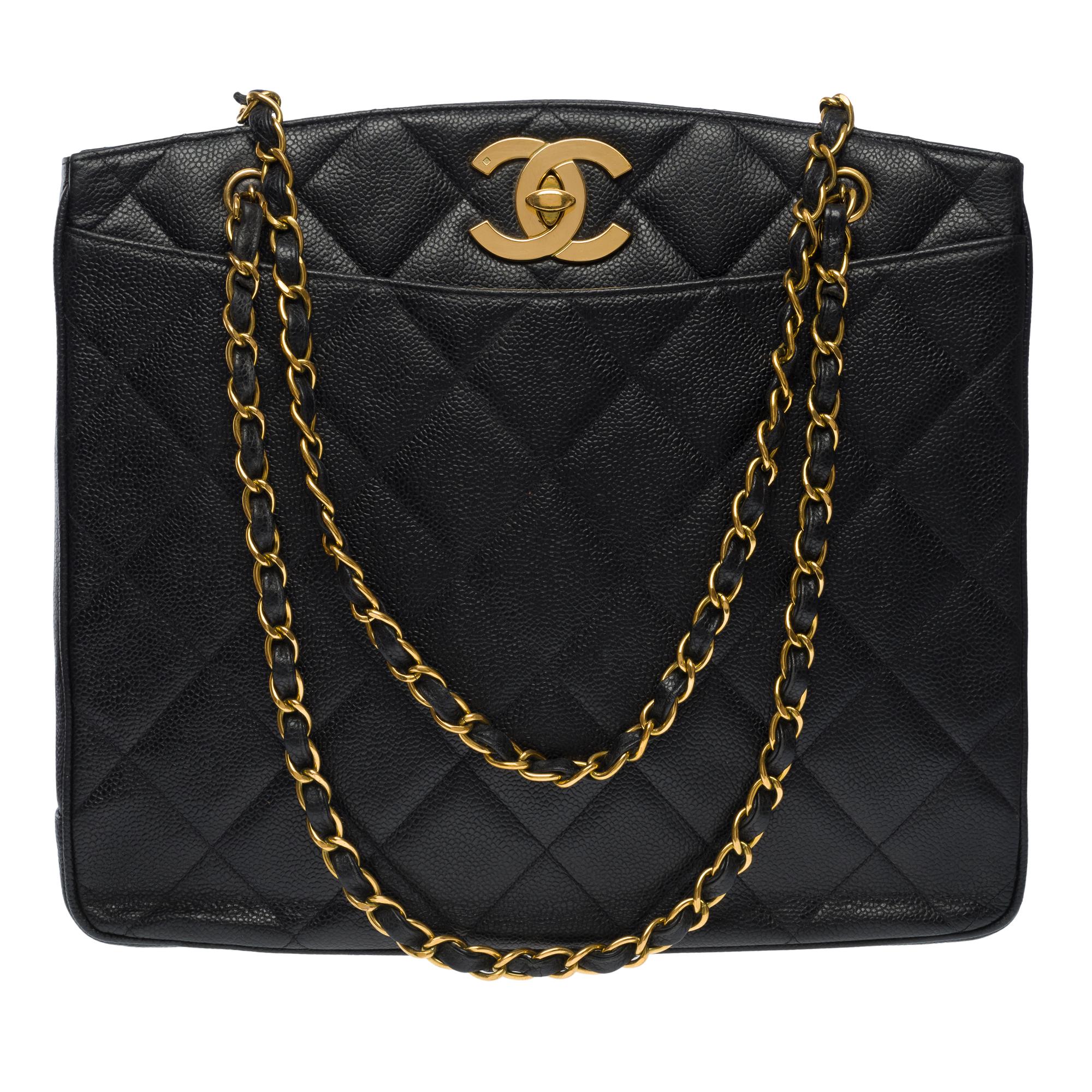 Stunning vintage Chanel Shopping Tote bag in black Caviar quilted leather , gold metal hardware, double chain handle gold metal interlaced black leather for a hand or shoulder carry

Black leather inner lining, 2 zipped pockets
Signature: 