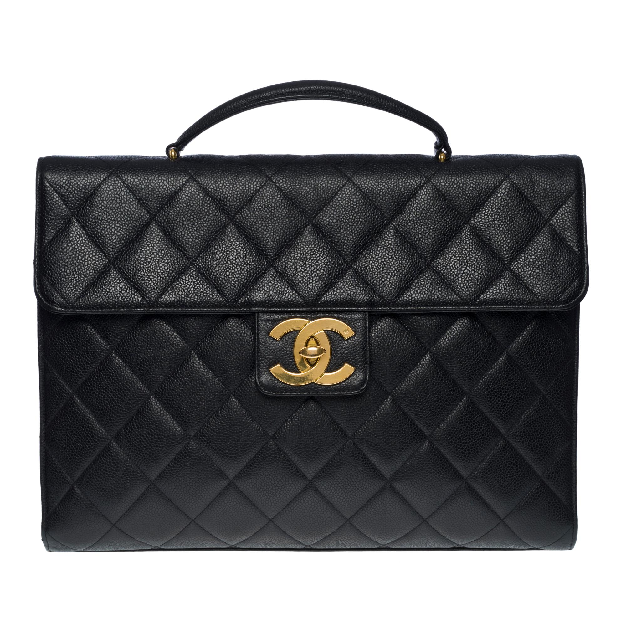Classy Chanel Briefcase in black caviar quilted leather, gold-plated metal hardware, a simple handle in black caviar leather for a hand-carried
Patch pocket on back of bag
Closure by flap, clasp with CC gold logo latch
Black leather lining, one