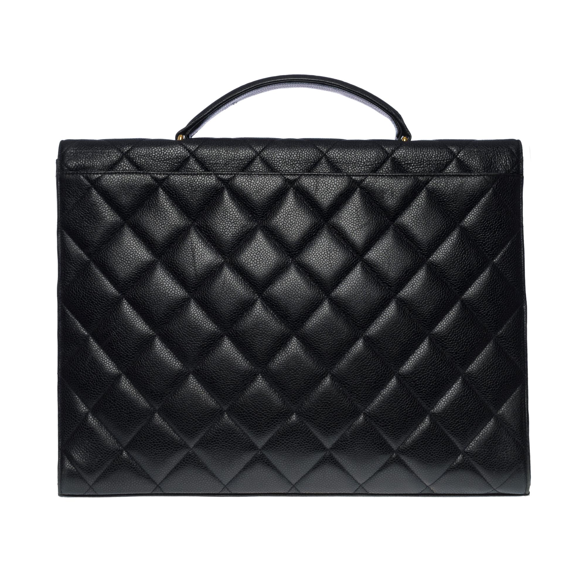 Classy Chanel Briefcase in black caviar quilted leather, gold-plated metal hardware, a simple handle in black caviar leather for a hand-carried
Patch pocket on back of bag
Closure by flap, clasp with CC gold logo latch
Black leather lining, one